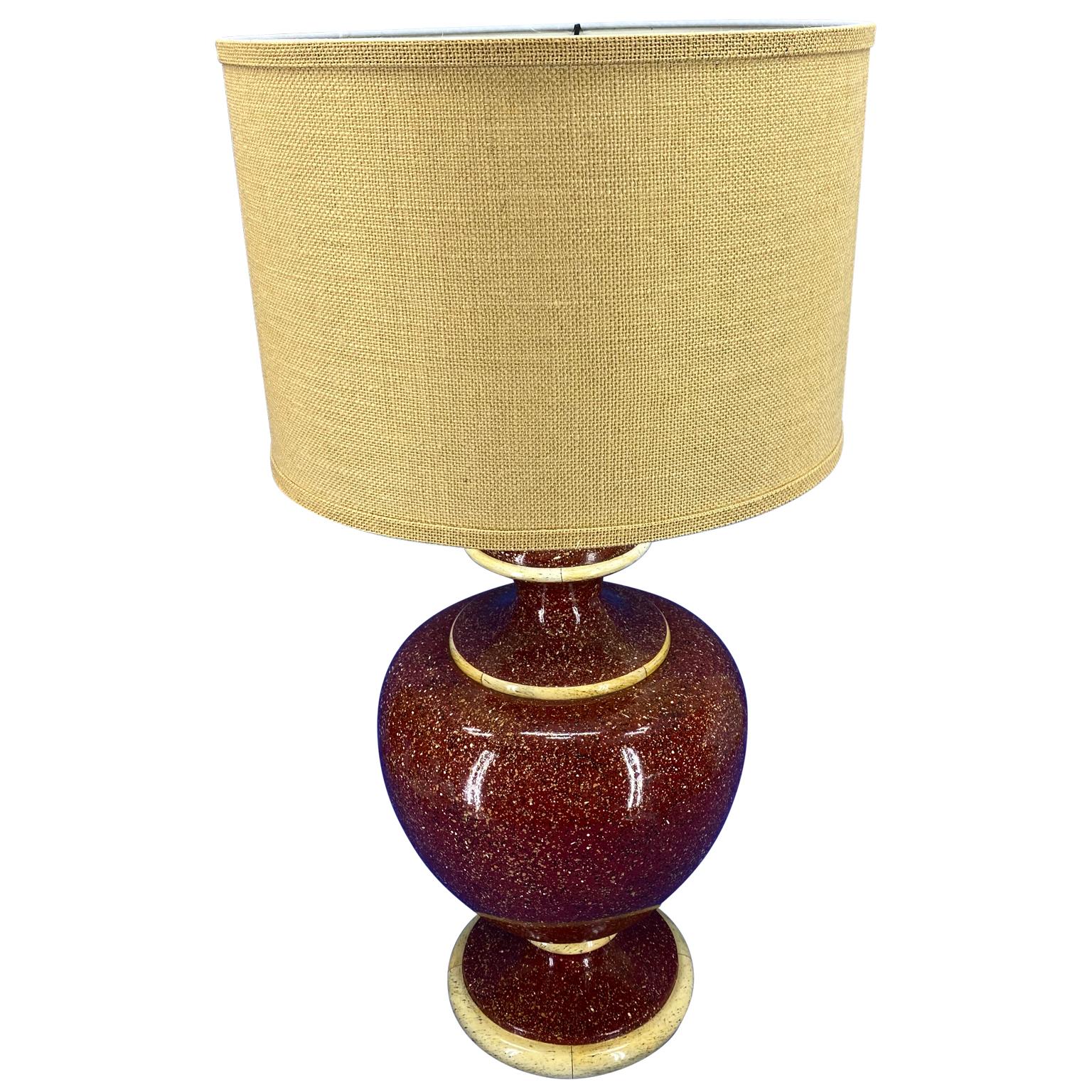 American Mid-Century Modern red faux marble table lamp.


  