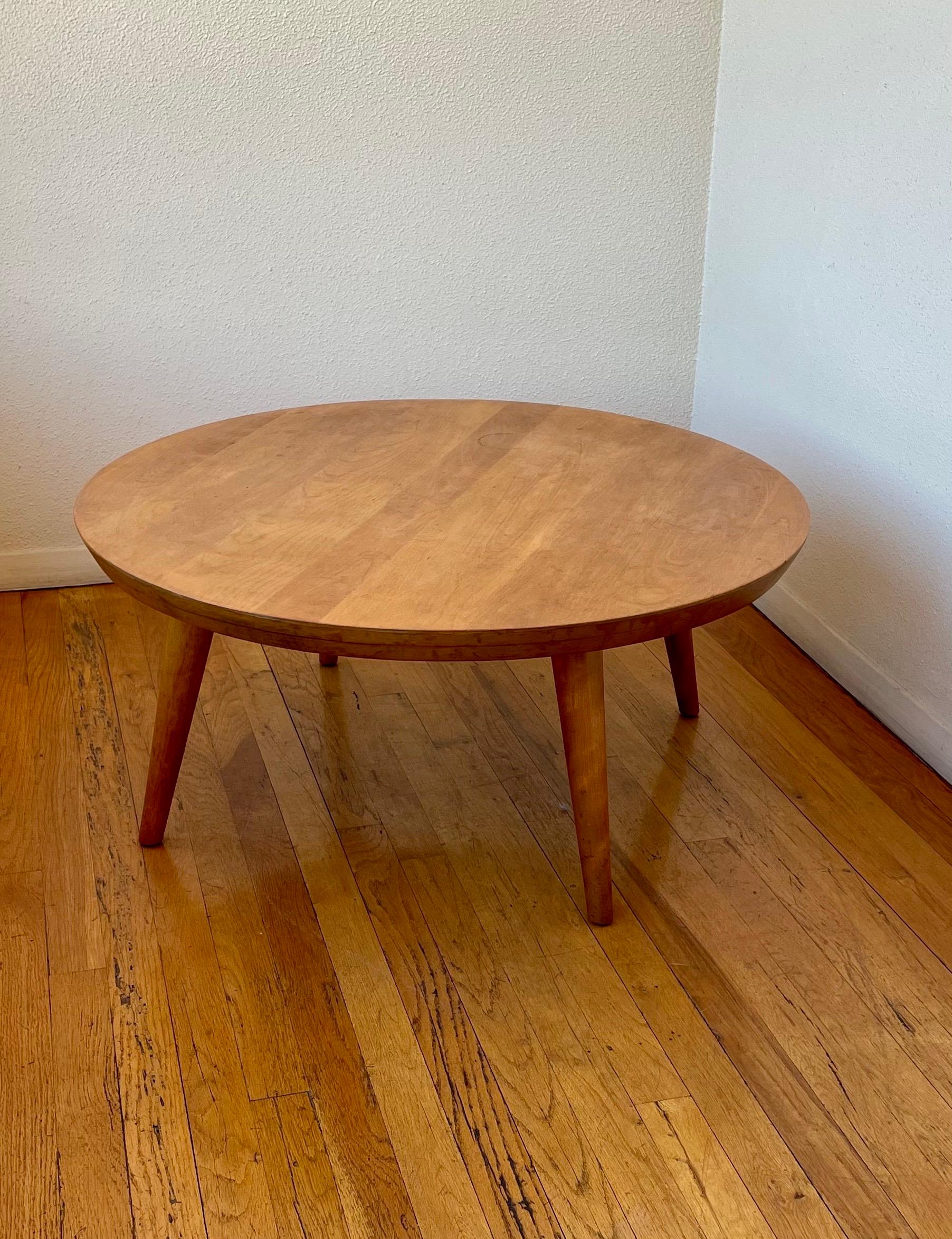 Beautiful solid maple round coffee table designed by Russel Wright for Conant ball, nice solid and sturdy we have refinished the top and clean oiled the legs.