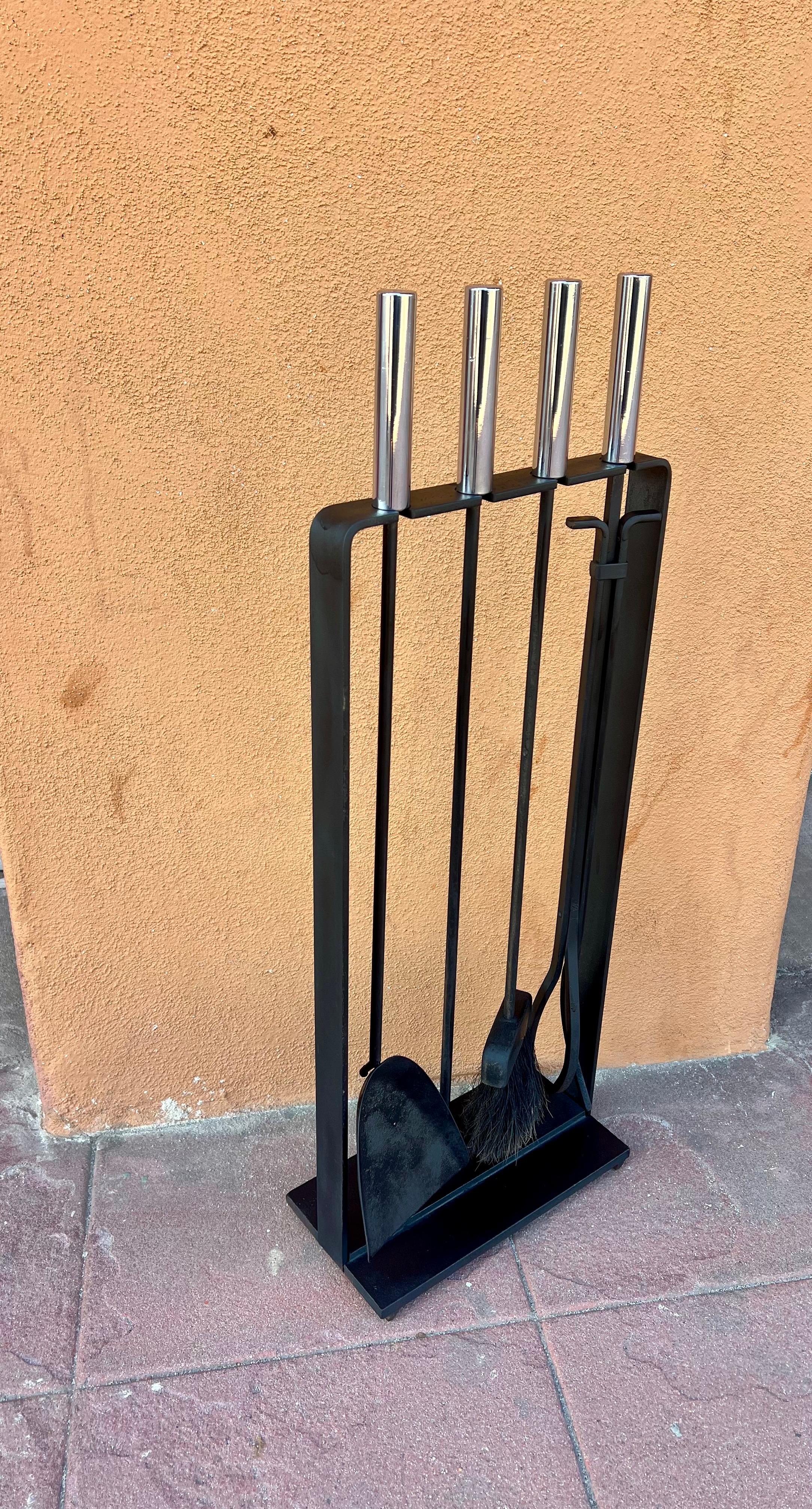 Solid iron fire tools set in black enameled finish with a nice patina in original condition. polished chrome handles can be used indoors or outdoors.