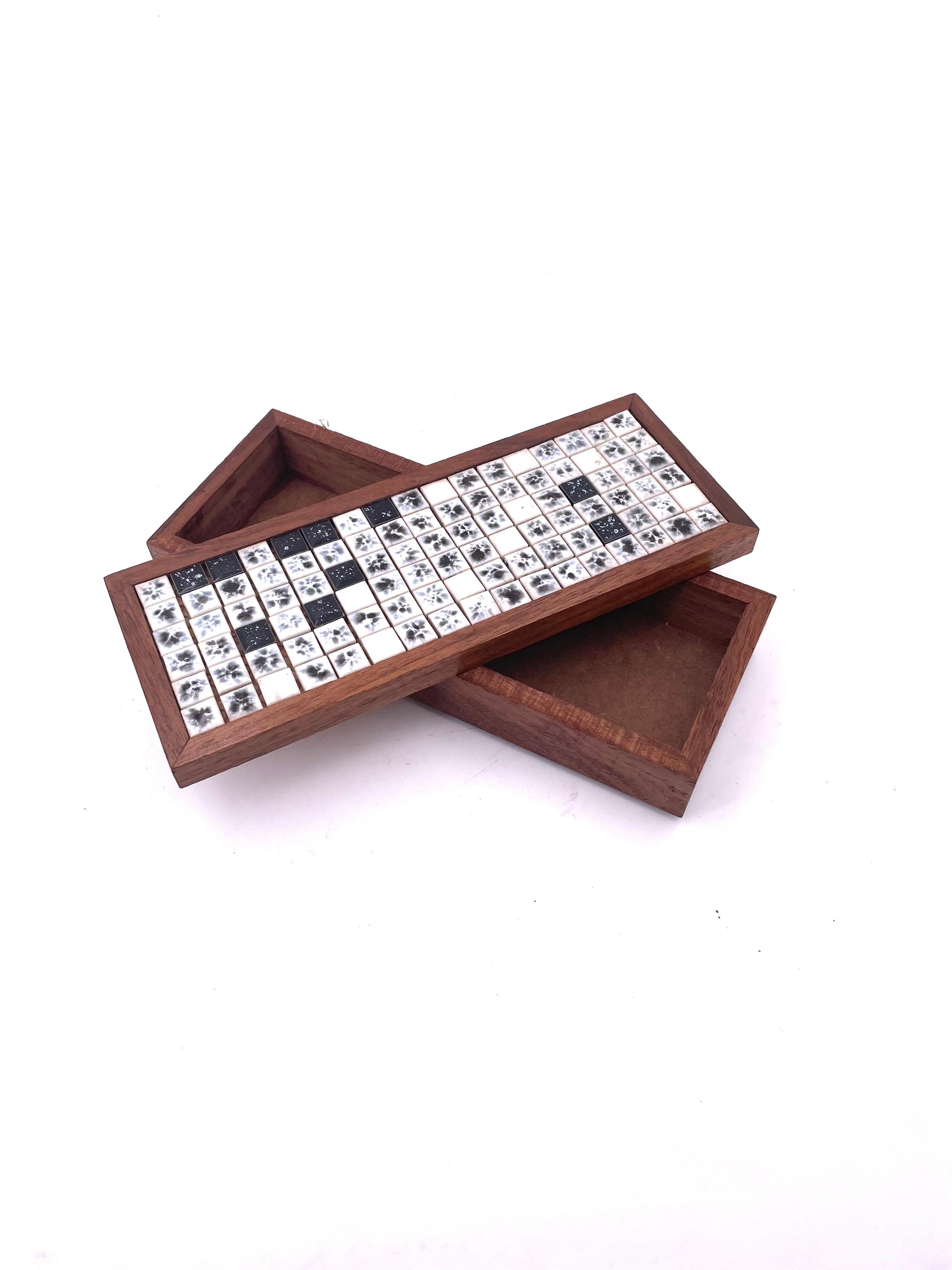 a jewelry box company offers simple jewelry boxes with decorative tiles