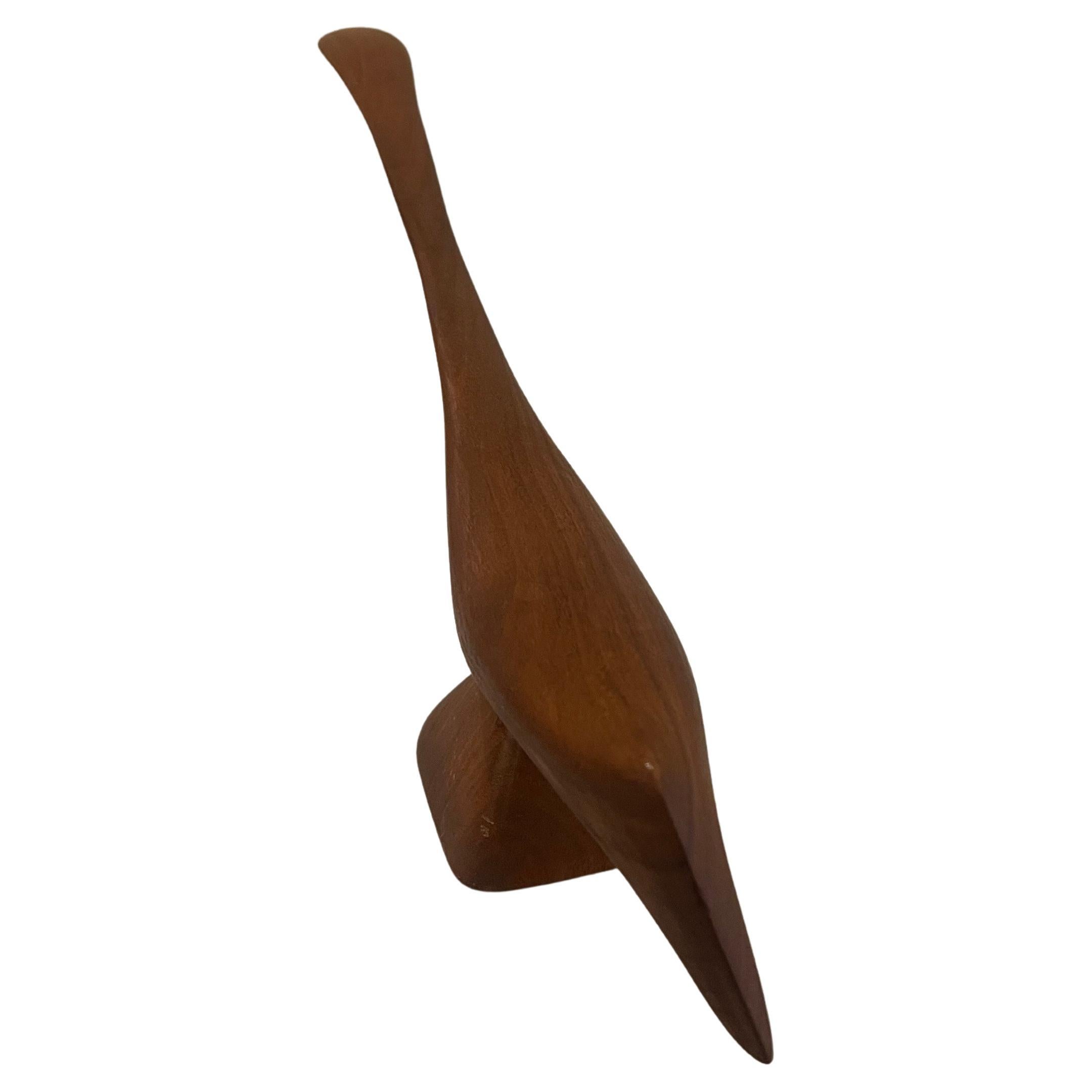 Beautiful solid walnut sculpted bird great condition circa 1970's. Signed at the bottom