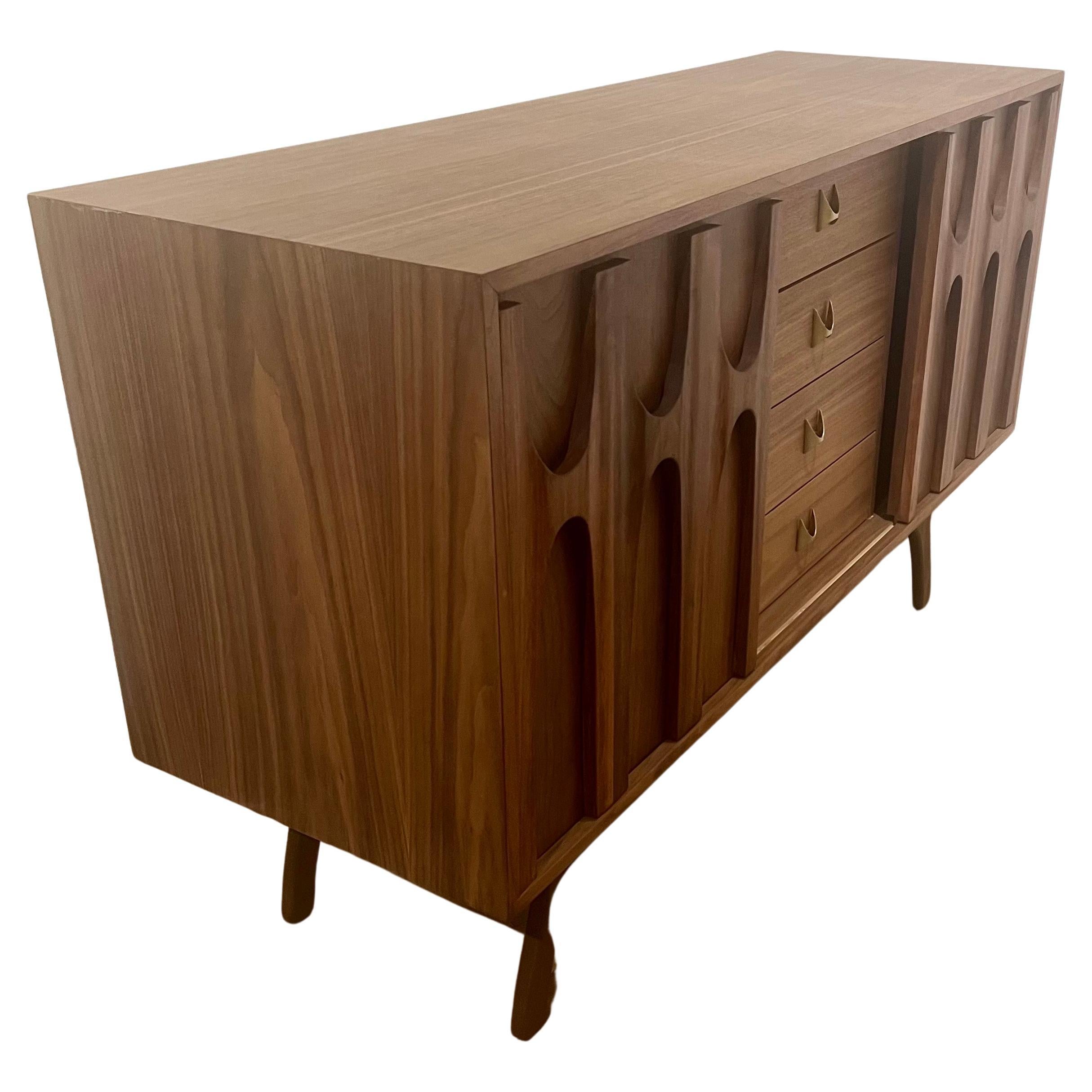 American walnut custom-made credenza in the style of Broyhill 4 drawers and 2 sliding doors with brass handles.