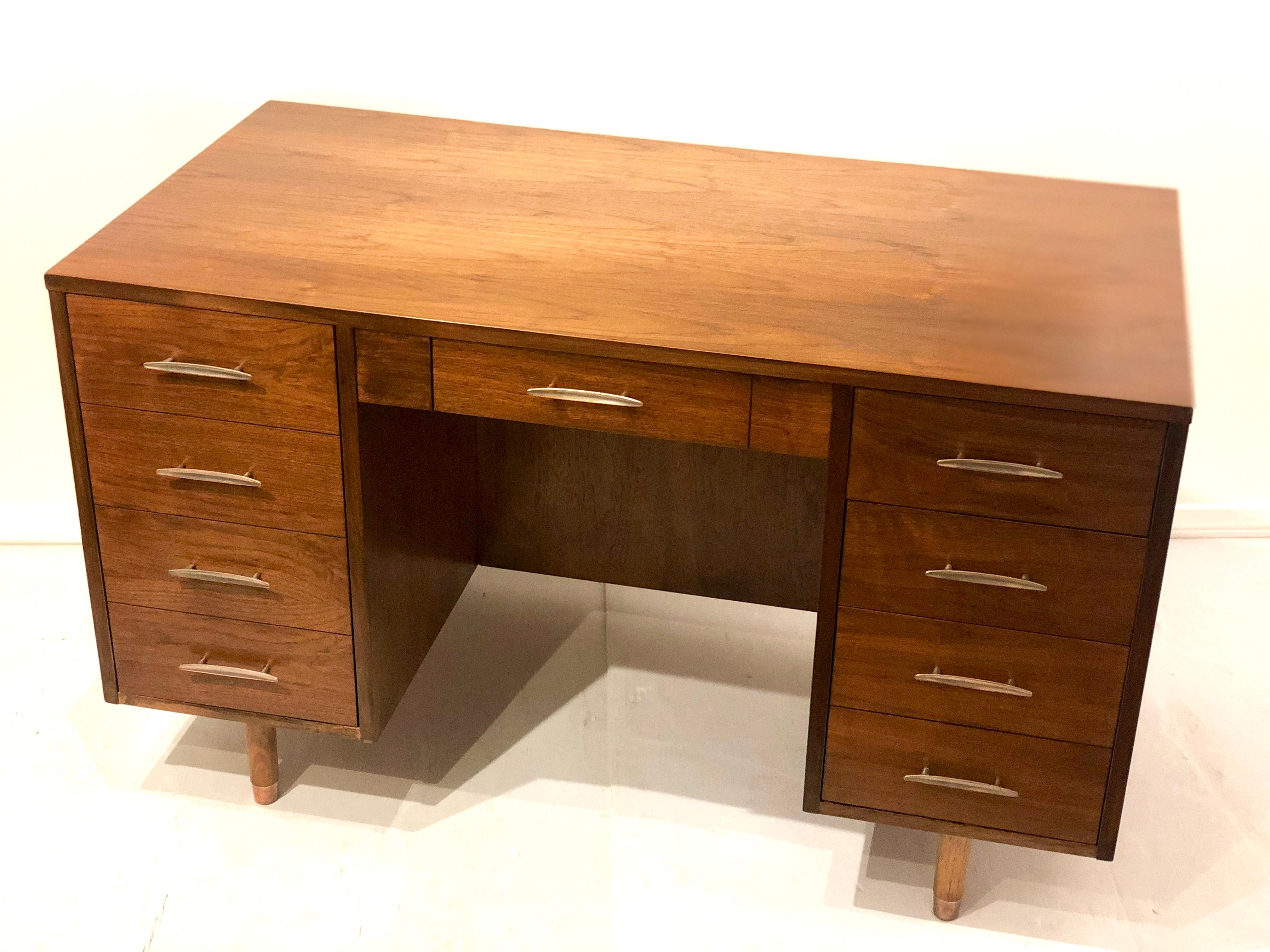 Beautiful walnut desk circa 1950s freshly restored with brass fittings versatile with pull side return, for easy storage when not in use, and front bookcase.