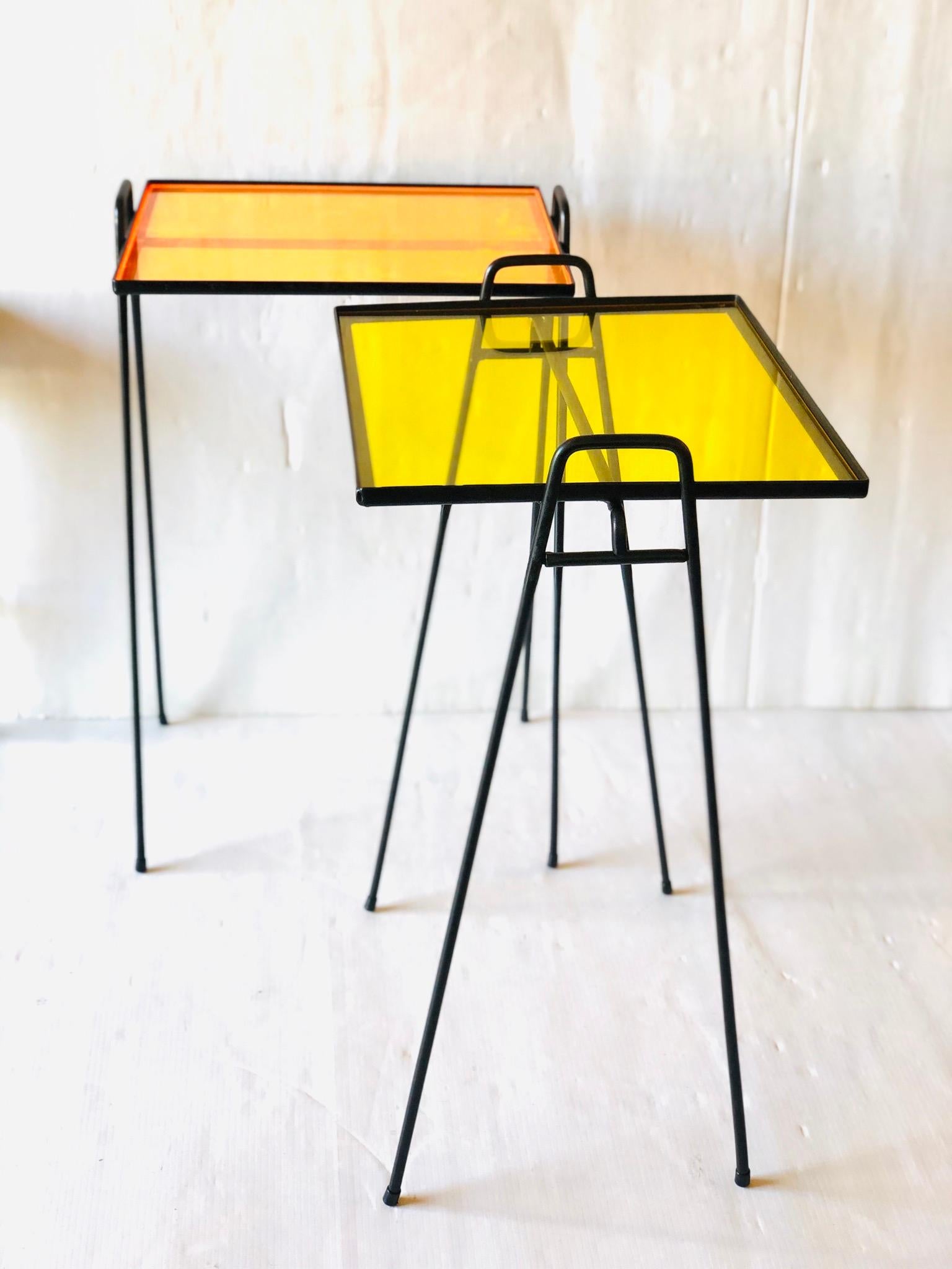 Nice pair of solid iron tubbing end tables, freshly powder coated and new acrylic color tops excellent condition.