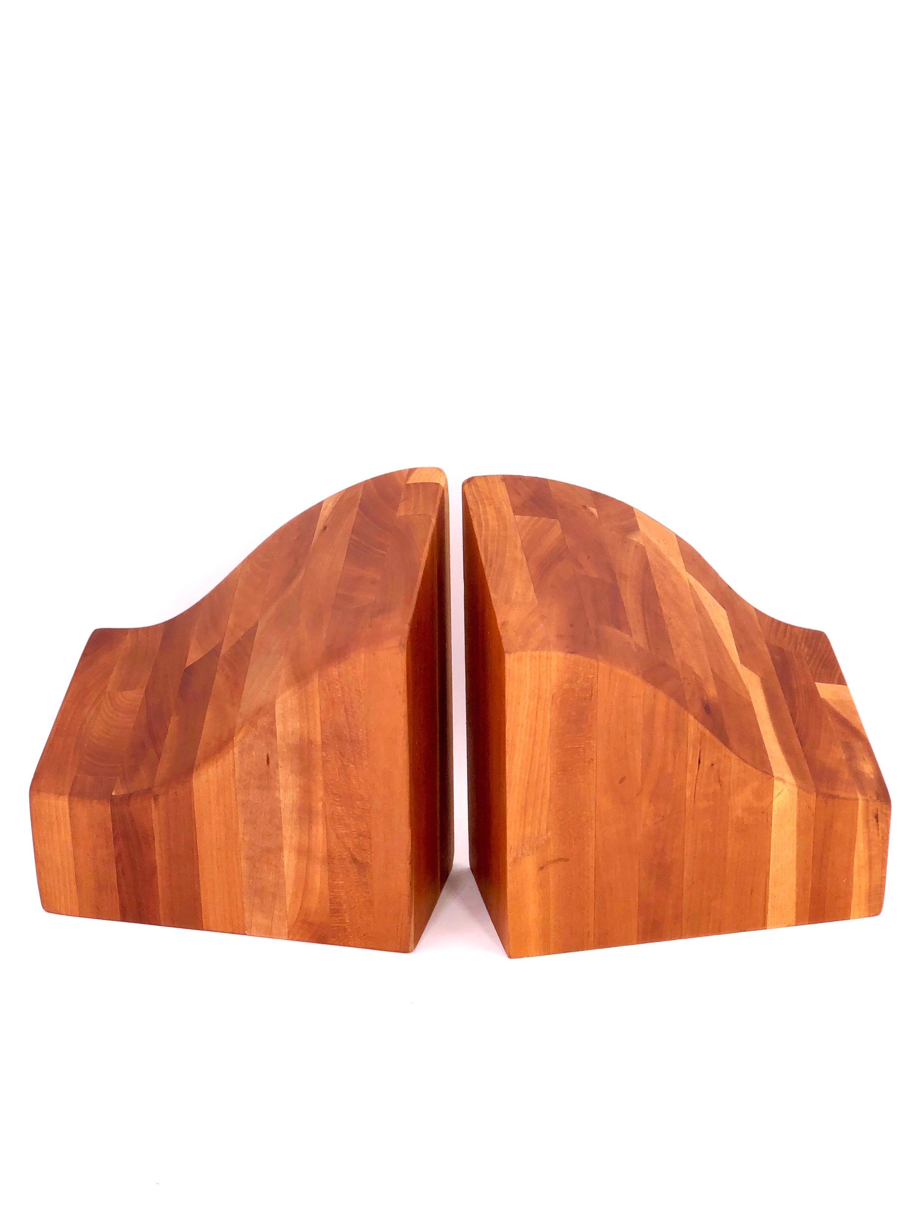 A beautiful and unique pair of organic shapes of solid cherrywood blocks bookends, in the style of Don Shomaker.
