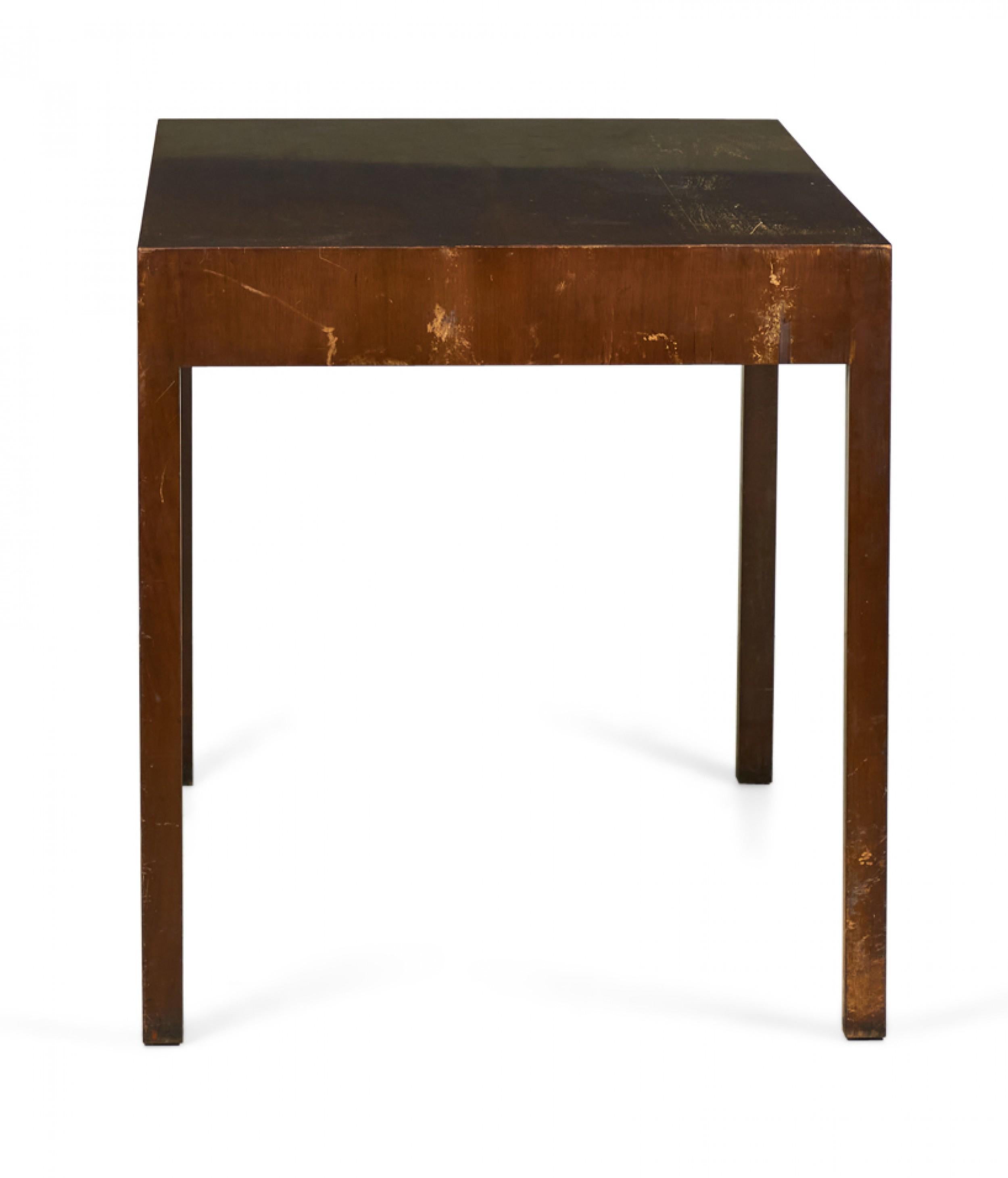 American Mid-Century Parsons-style rectangular partners desk / table with three low-profile drawers on each side.
