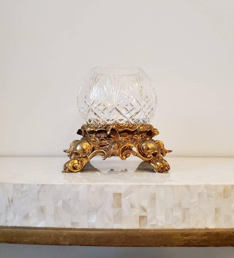 An American mid-century Pitman-Dreitzer Lancaster Company Baroque gilt-brass candle or punch bowl stand, with ornate detailing, pierced scrolls, signed reverso, paired with a stunning vintage Bohemian Czech lead crystal cut glass globe votive -