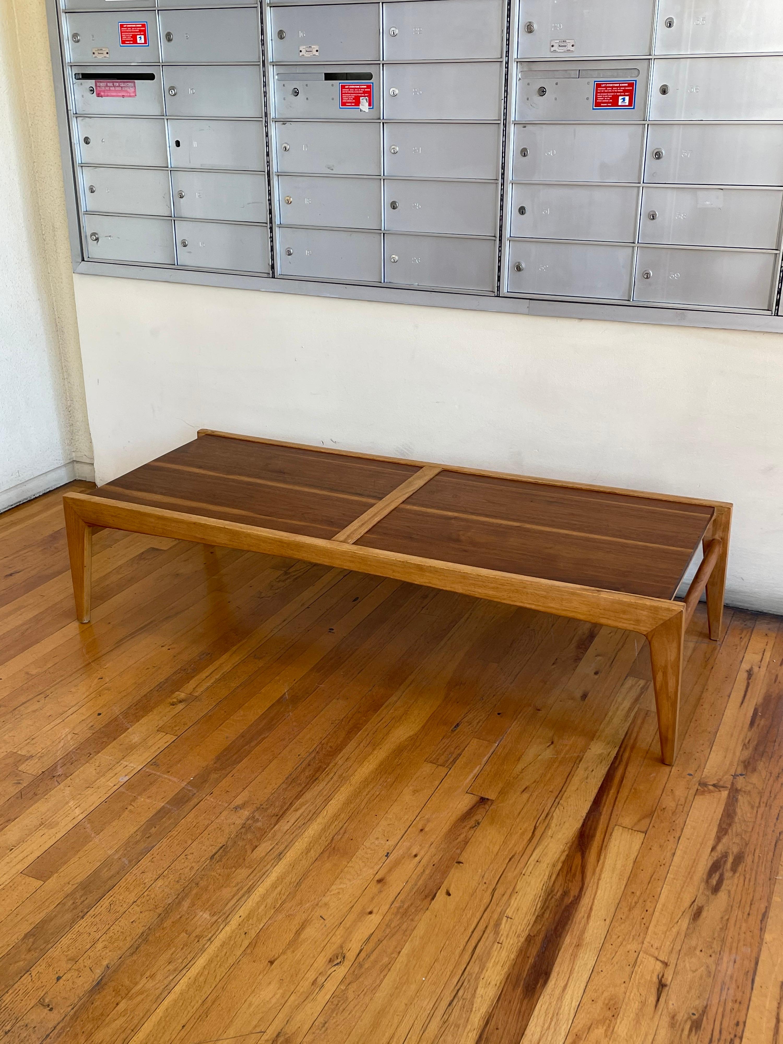An architectural beautiful solid walnut and birch wood construction, coffee table by Drexel. circa the 1950s.