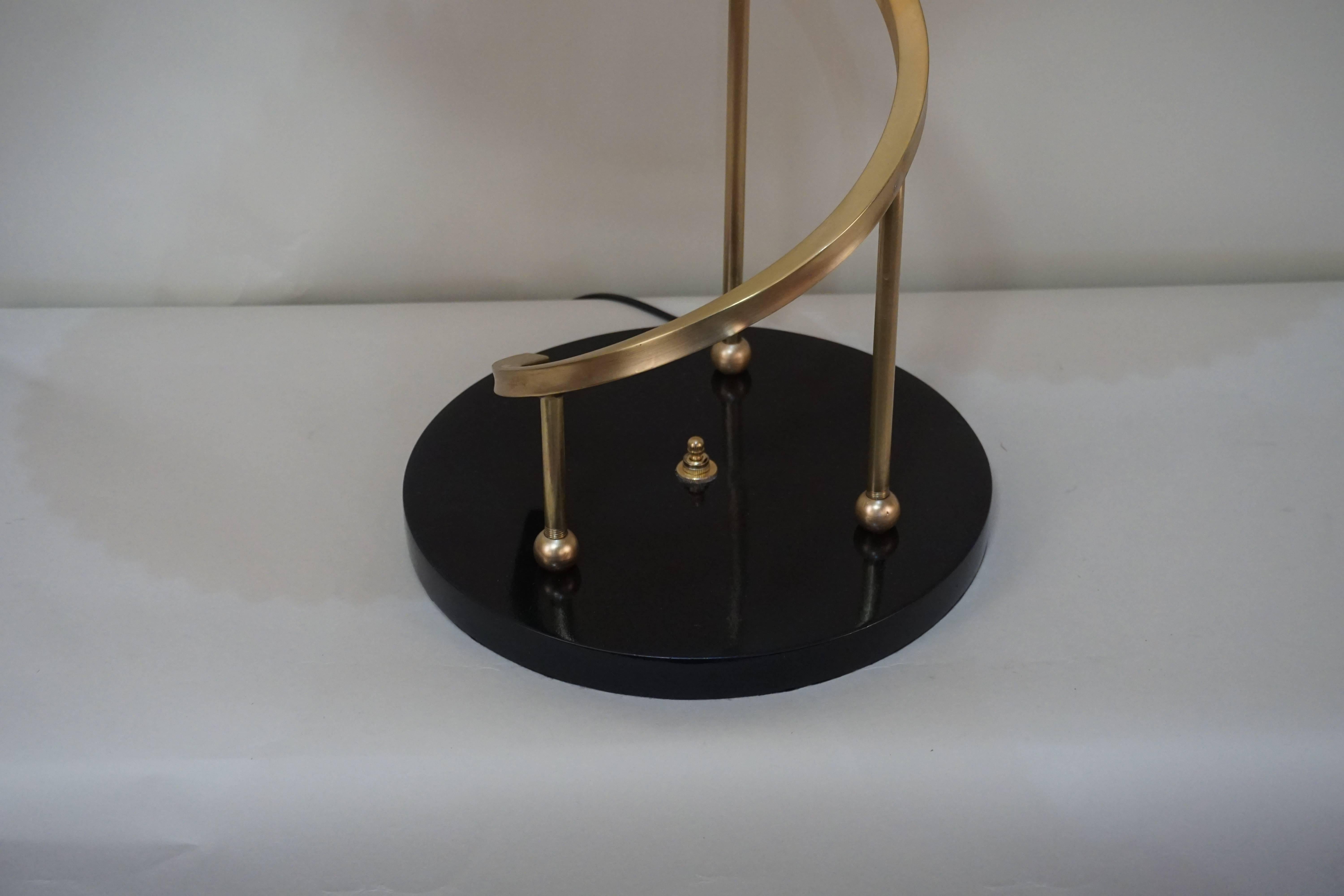 Elegant and very rare double light midcentury brass and glass table lamp.