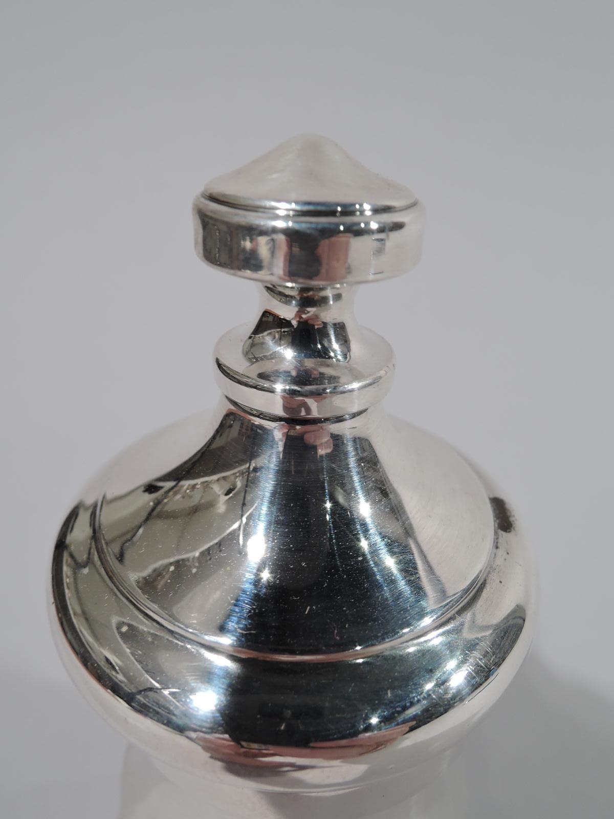 American sterling silver pepper grinder, circa 1950. Shapely baluster with ringed base and rotating domed cover. Hallmarked. Hardware marked Peugeot Freres.