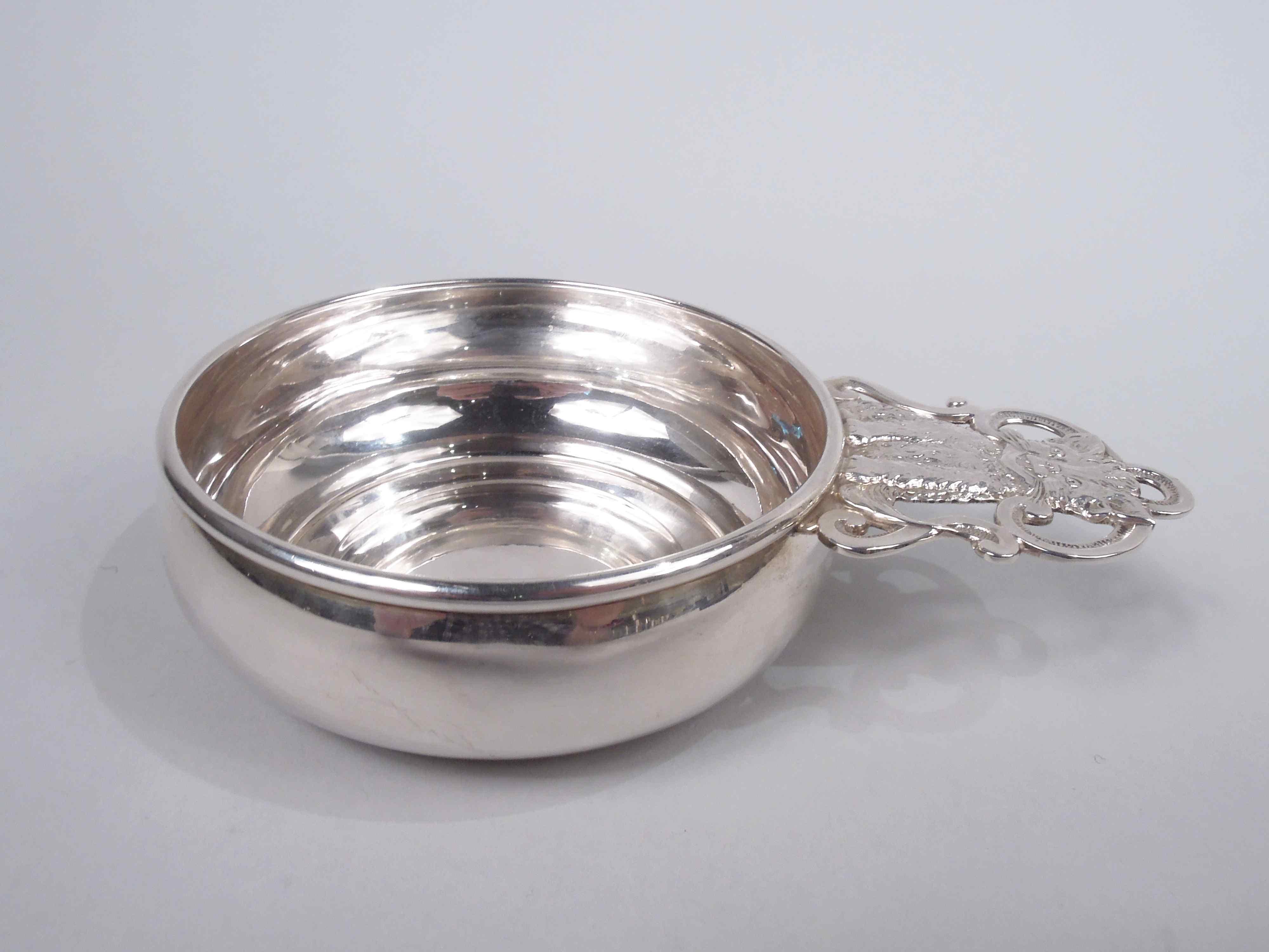 Midcentury Modern sterling silver porringer. Made by Richard Dimes in Boston. Curved sides and cast open and scrolled handle with kitty sitting pretty, with stiffened forelegs and gaping, gleeful mouth. Fully marked including maker’s stamp and no.