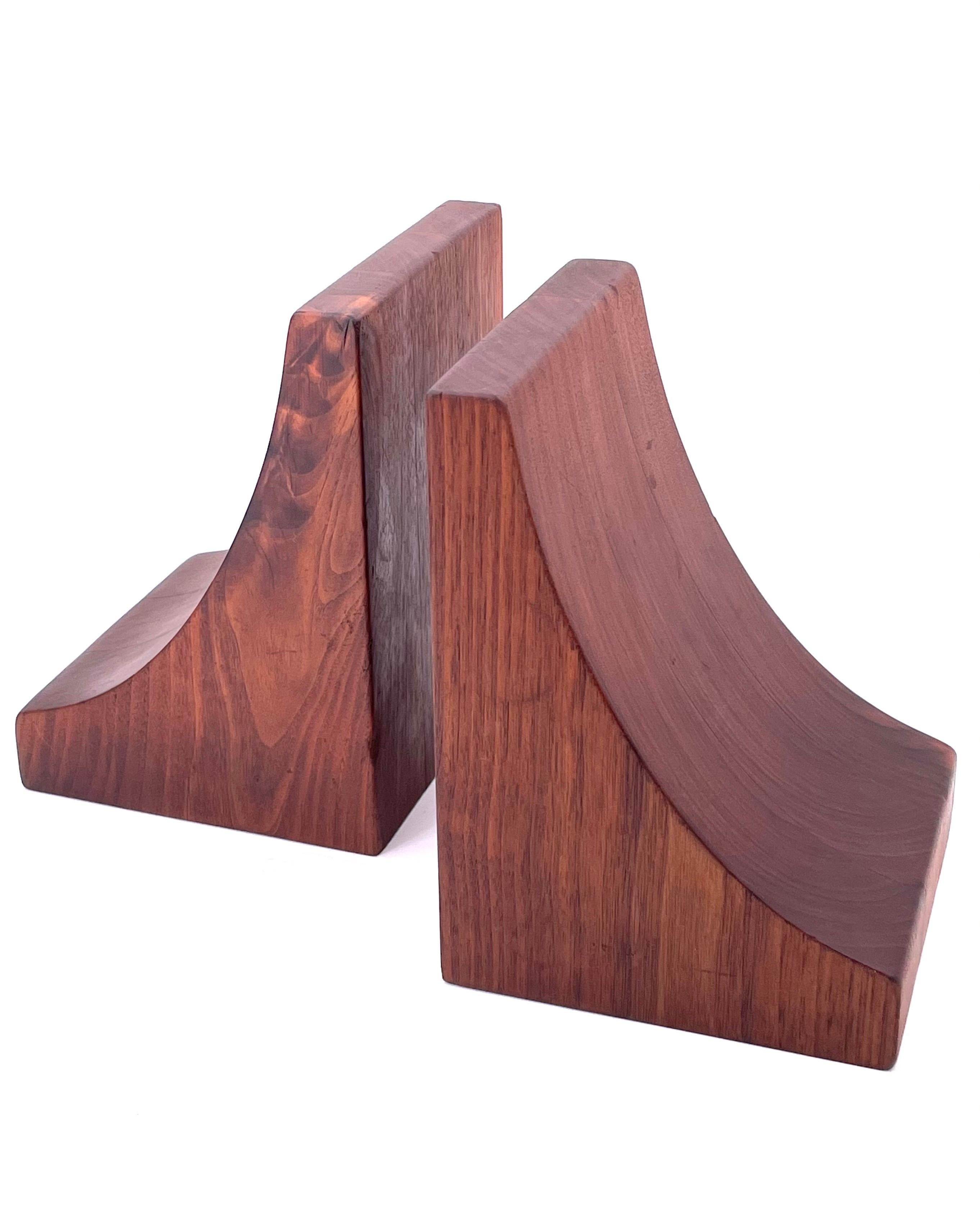 A beautiful and unique pair of organic shapes of solid walnut blocks bookends, in the style of Don Shomaker.