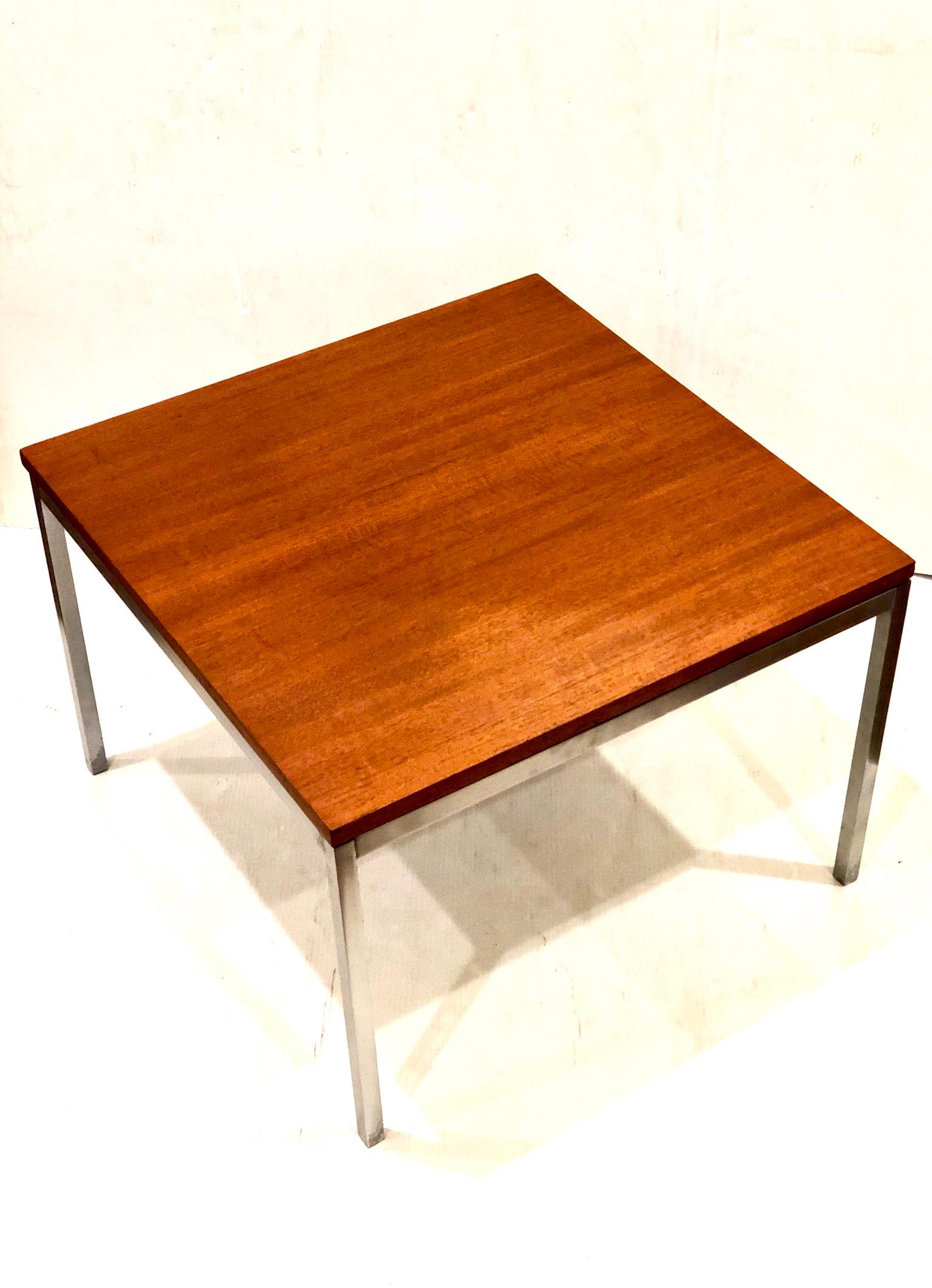 Simple elegant brushed stainless steel small coffee table by Knoll freshly refinished top and polished the base retains original early production label. The base and corners shows light wear due to age as shown.