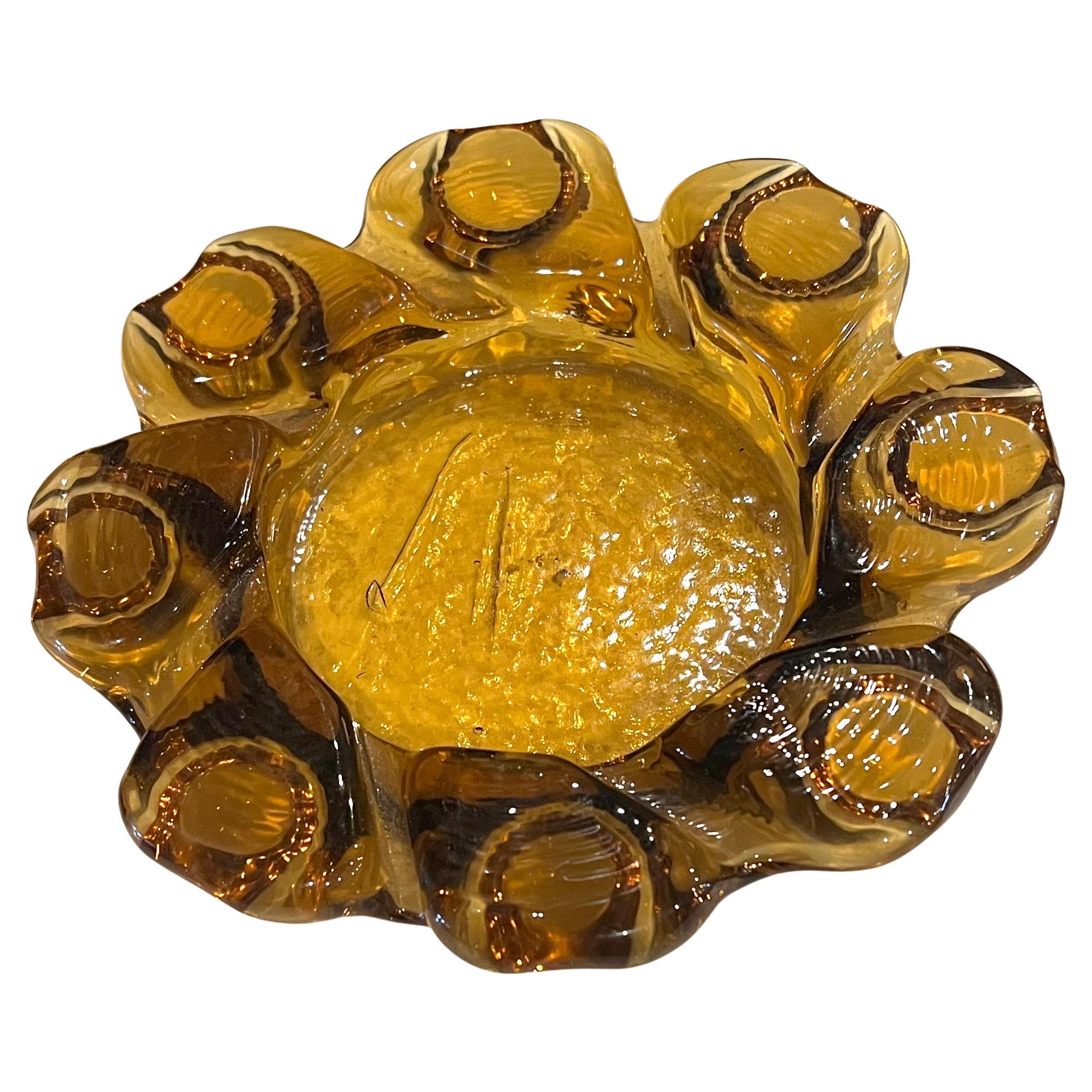 A beautiful Brutalist textured glass amber color ashtray, excellent condition no chips or cracks.