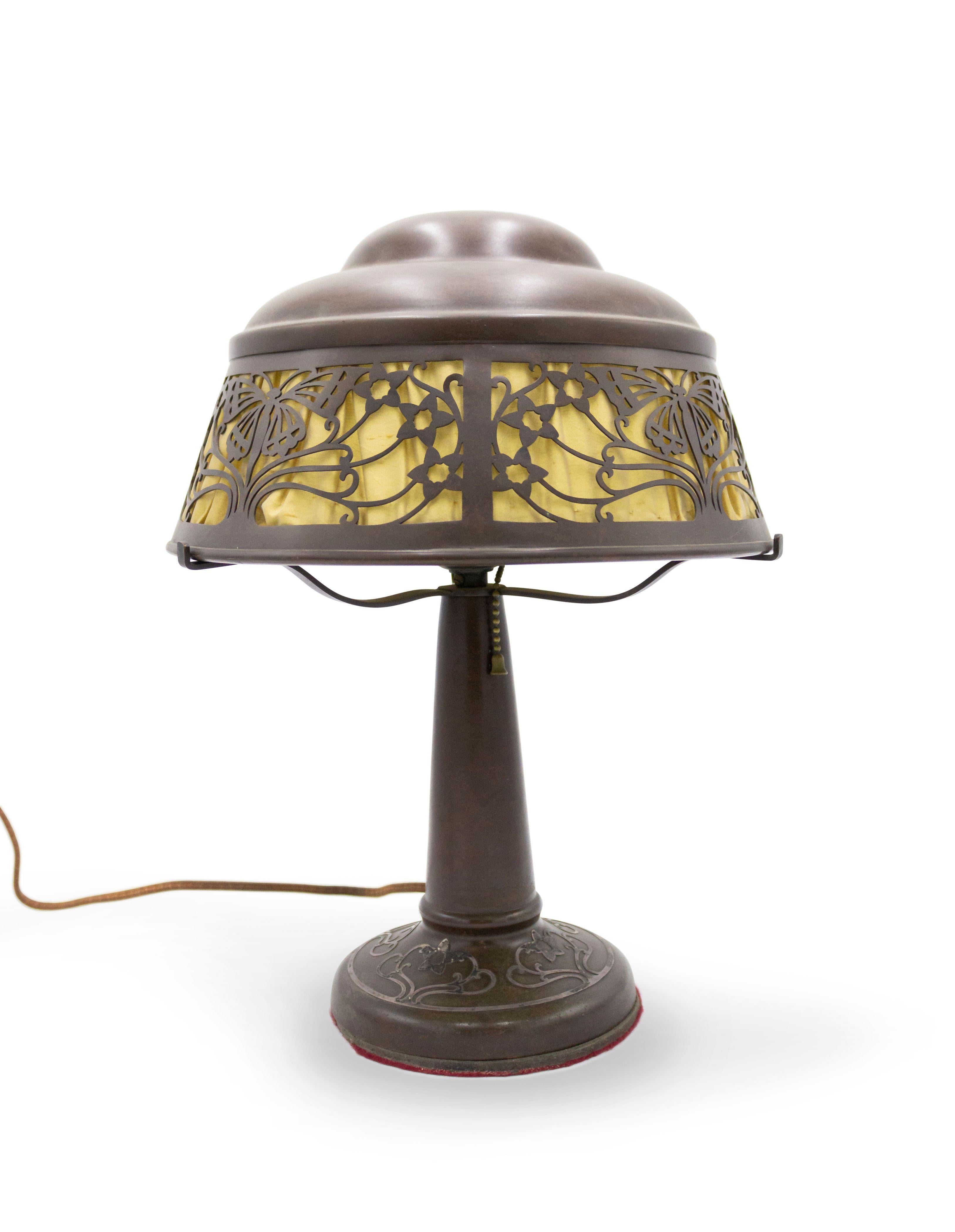 American Mission bronze patinated table lamp with silver deposit floral design base and filigree butterfly motif shade (HEINTZ ART METAL).
