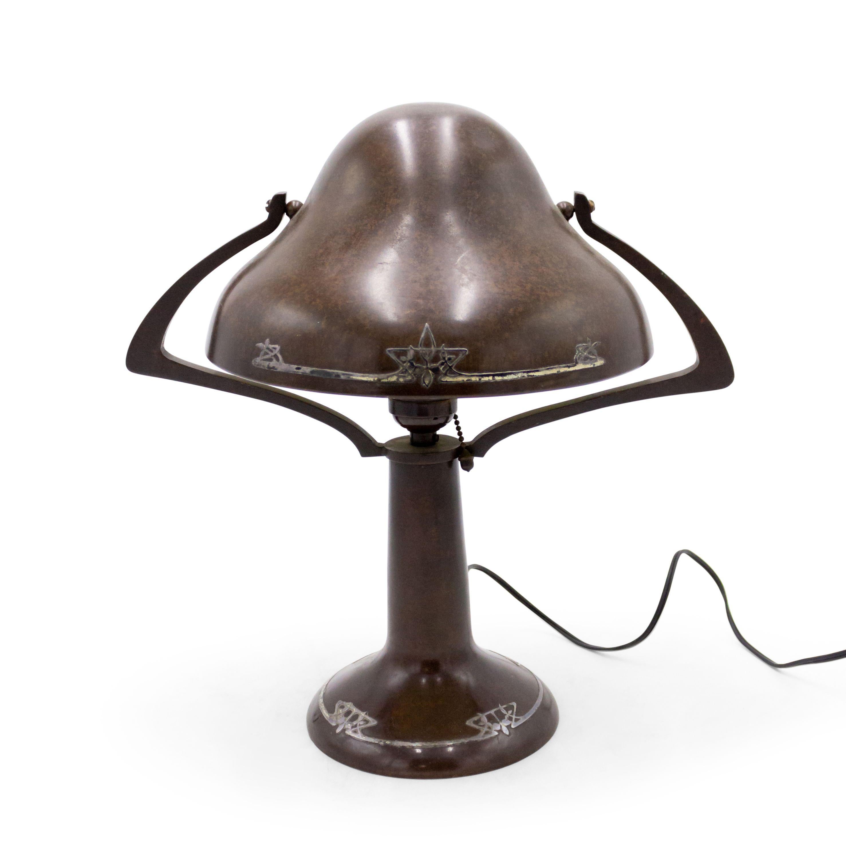 American Mission bronze patinated table lamp with floral whiplash silver deposit base and helmet shaped shade (HEINTZ ART METAL).
