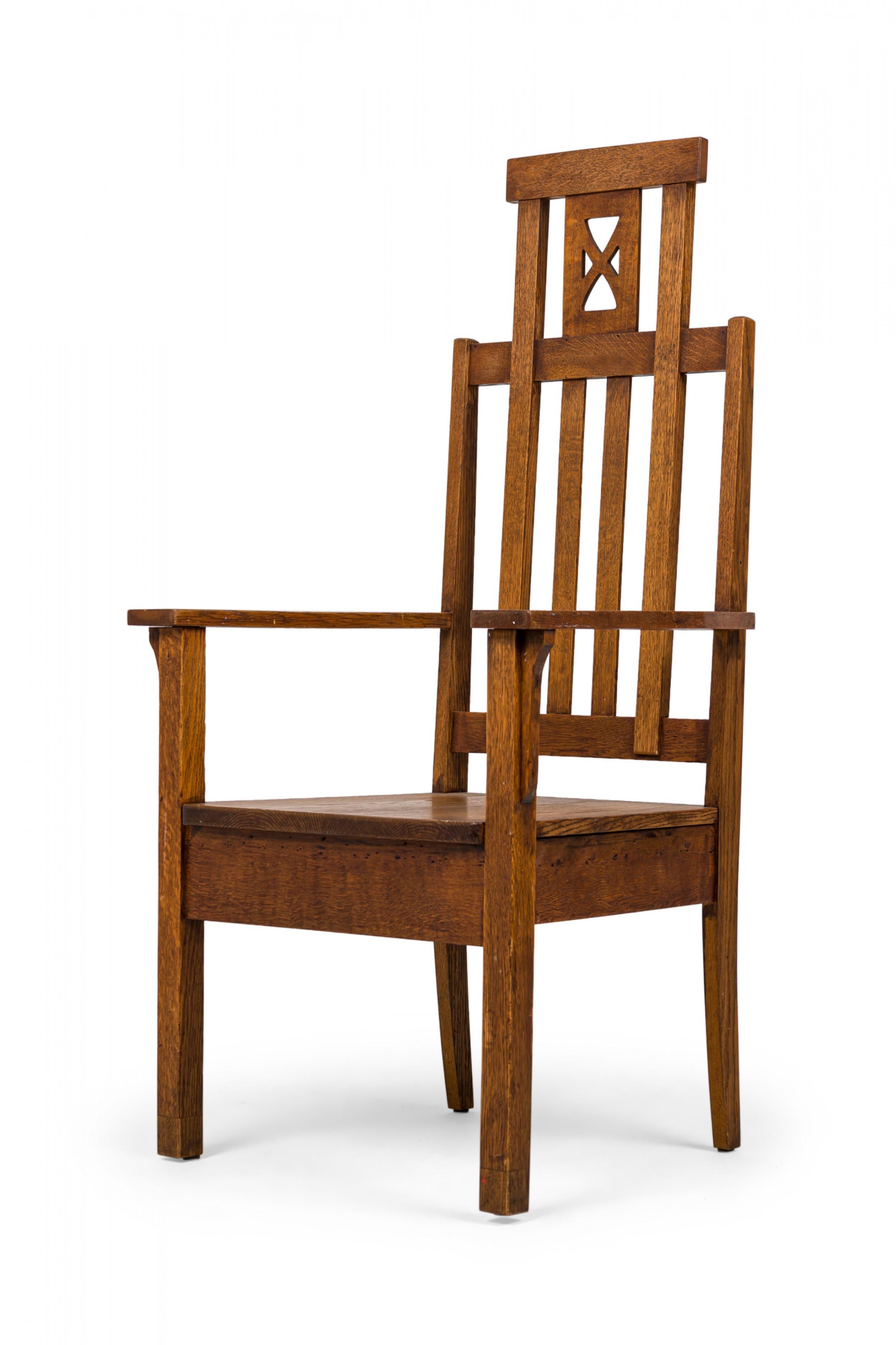American Mission high back oak armchair with a slat back topped with an extended headrest featuring an x-design interior, resting on four square legs.