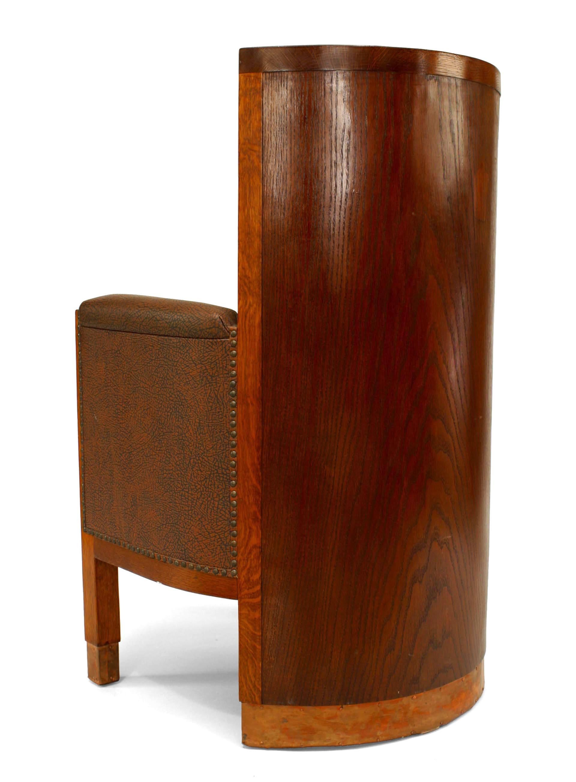 Pair of American Mission-style (19/20th Century) stained oak barrel back arm chairs with solid wood back and copper trim on base of back and front legs with brown leatherette upholstered seat and back. (PRICED AS Pair)