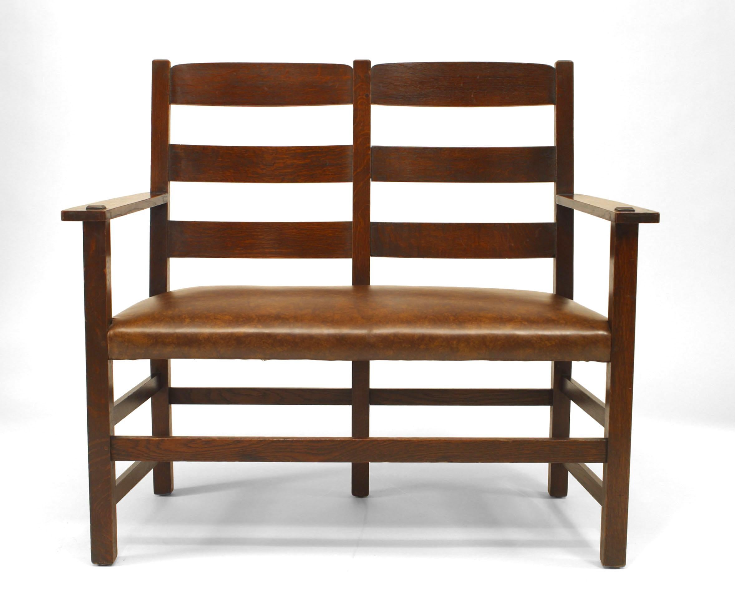 American Mission oak loveseat with triple ladder back and brown leather seat (signed LIMBERT BROS..)
