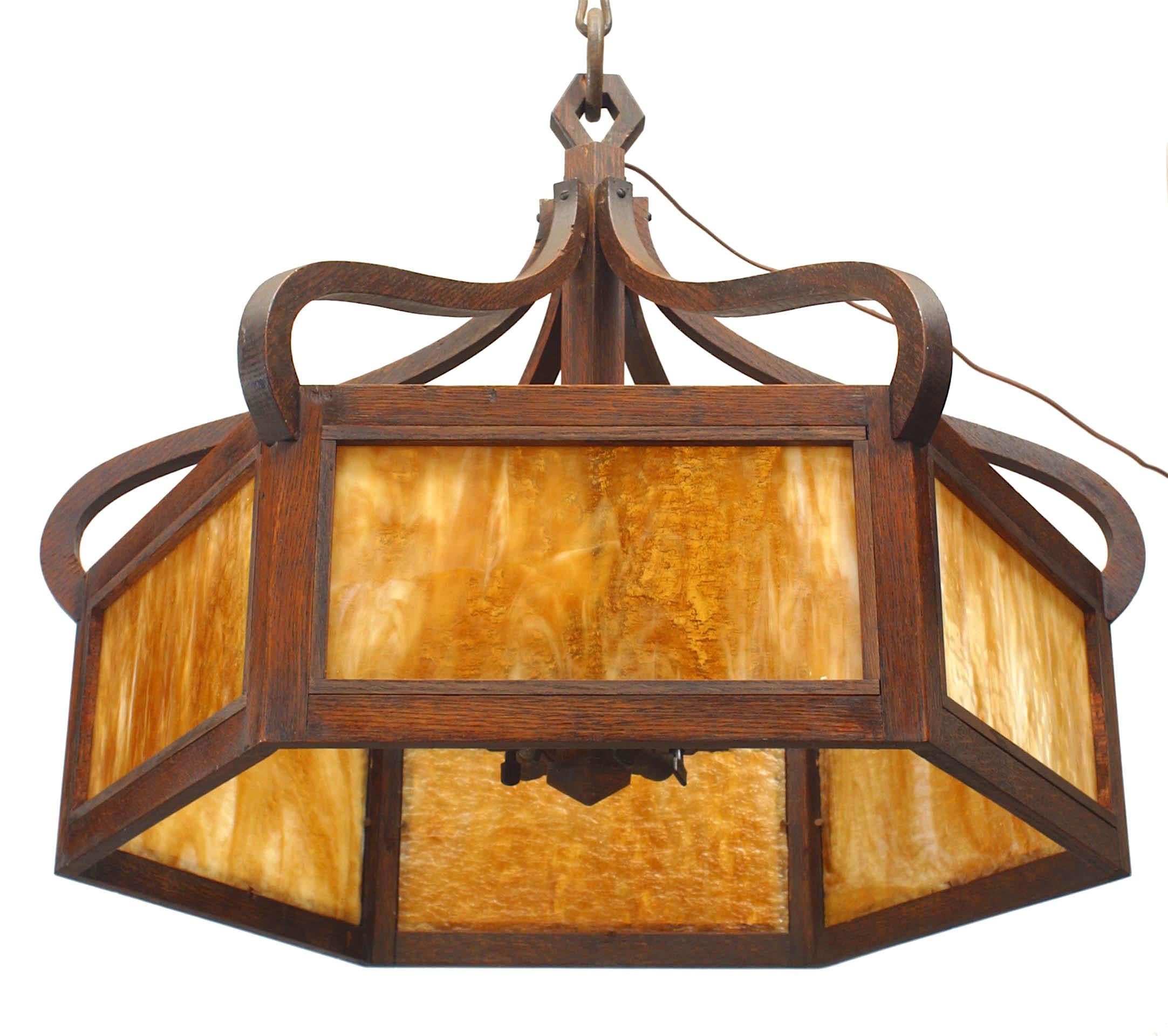 American Mission 6 sided chandelier with stained oak framed caramel slag glass panels supported by a canopy with curved design supports.
