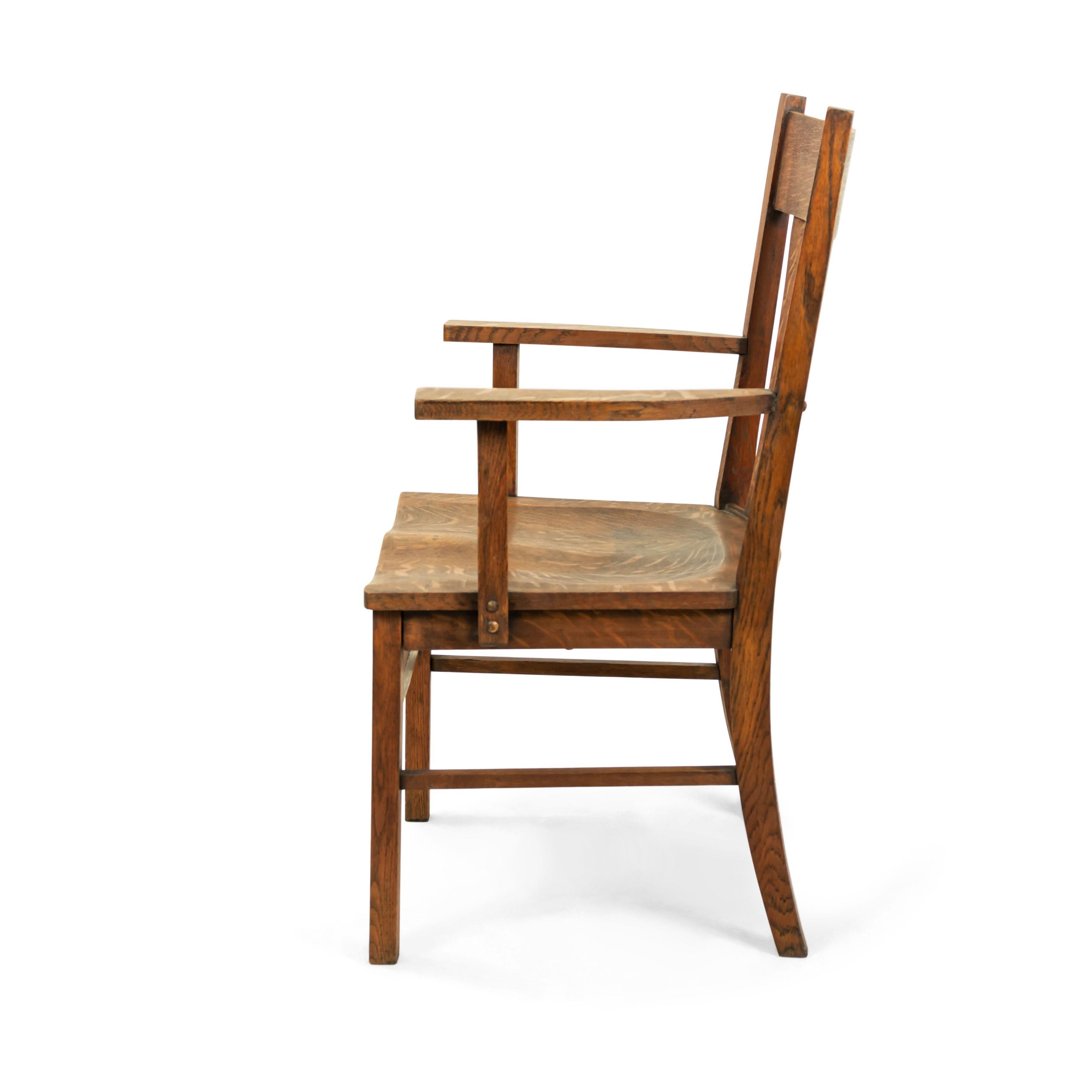 American Mission-style wooden armchair with a four slat back and wooden seat.
 