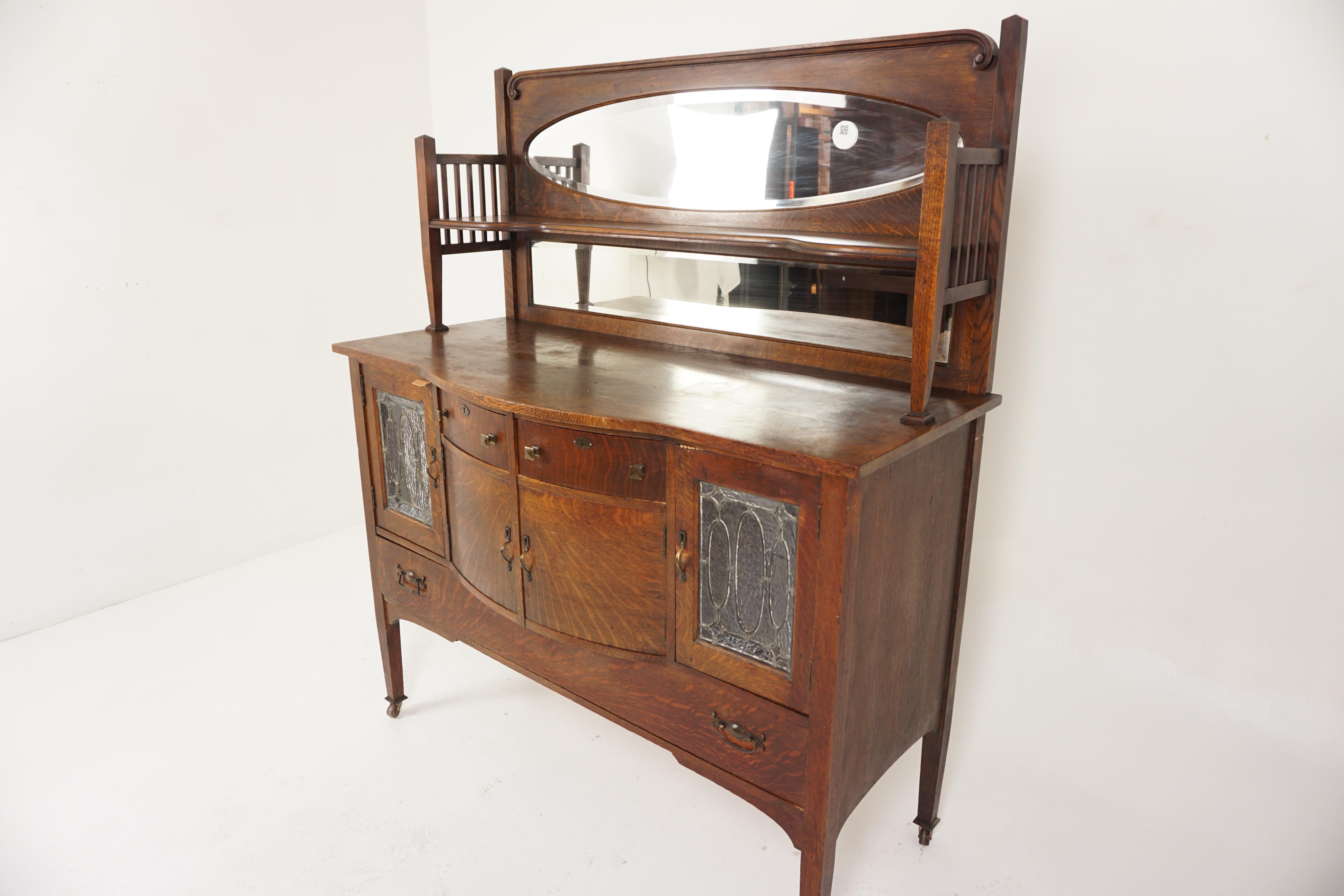 American Mission Tiger Oak Mirror Back Sideboard Leaded Glass, American 1910, H700

American 1910
Solid Oak
Original Finish
Galleried top with shaped shelf
Oval bevelled mirror on top
Rectangular mirror underneath
Open sides
Base with bow front