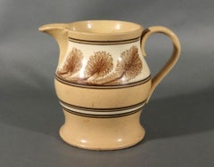 American Mocha Yellow Ware Jug with Puce Seaweed Decoration