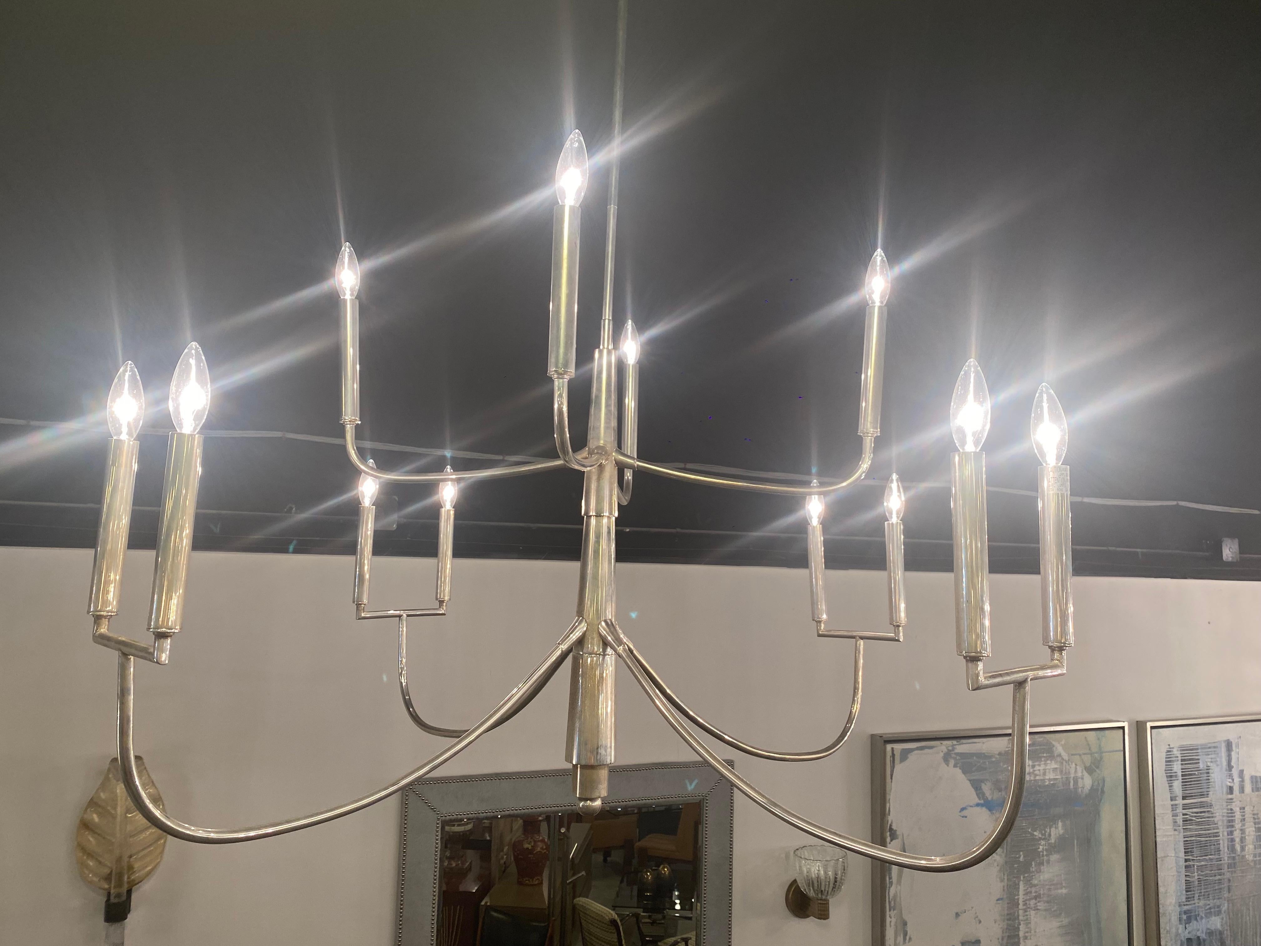 American Modern 12 Light 8 Arm Polished Silver Chandelier In Good Condition For Sale In Hollywood, FL