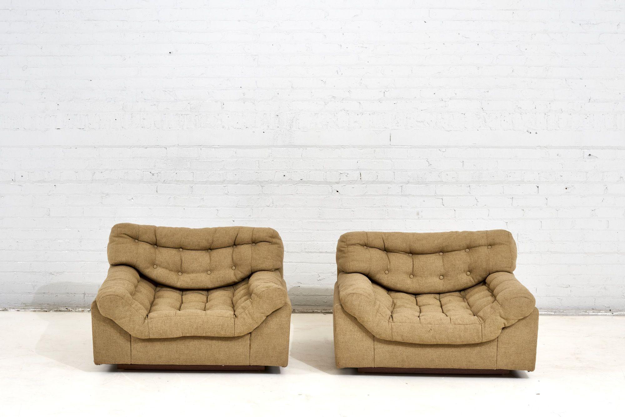 American Modern biscuit tufted lounge chairs with walnut plinth bases, 1960.  Original upholstery.