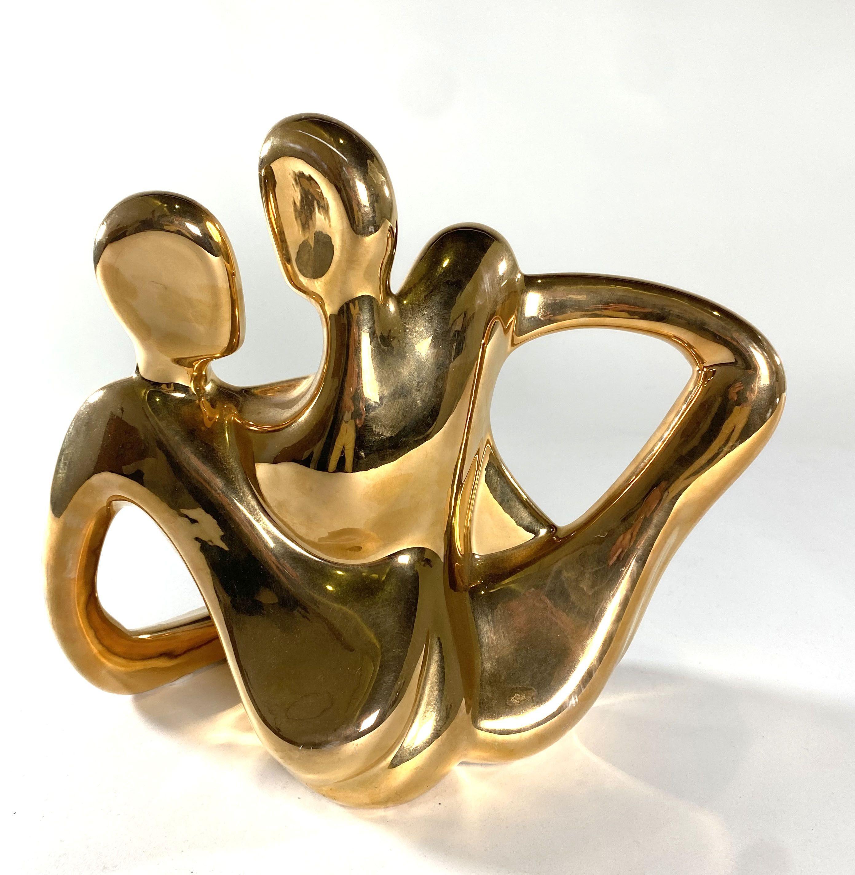 Glazed in gold, with real gold in the glaze. These figures in silver and gold are rare and hard to find. Production of these was short lived as the glaze became too expensive to produce.