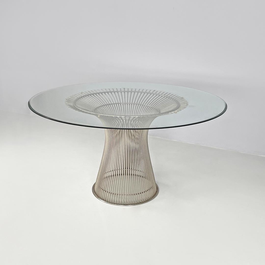 American modern dining table in glass and metal by Warren Platner for Knoll 1966
Round dining table with glass top. The structure follows curved lines, opens under the top to support it, then narrows in the center and finally opens again to rest on