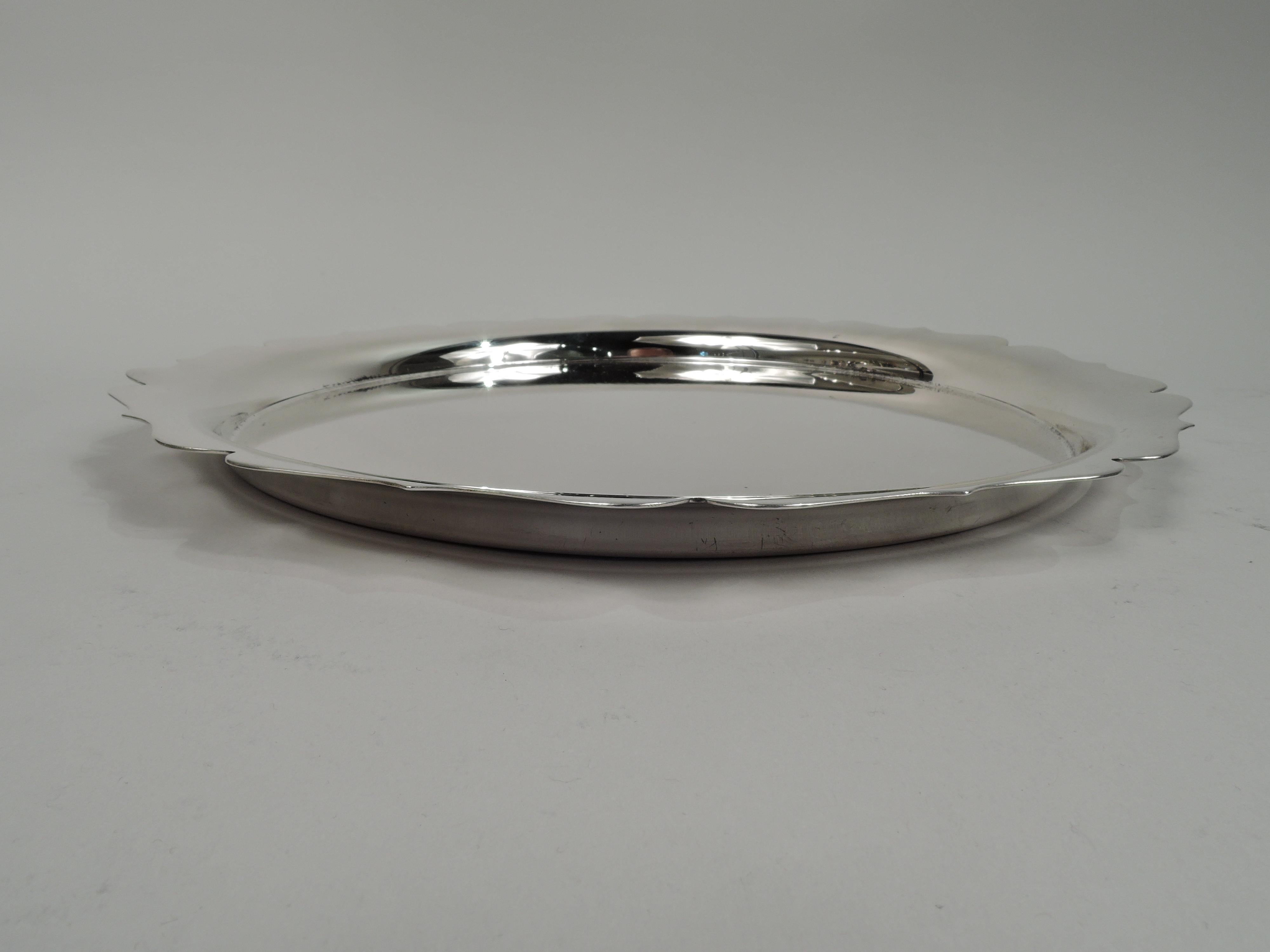 Modern Georgian sterling silver tray. Made by Fisher in Jersey City. Round well and crisp ogee piecrust rim. A nice traditional piece with plenty of room for engraving. Fully marked including maker’s stamp and no. 2864. Weight: 18 troy ounces.