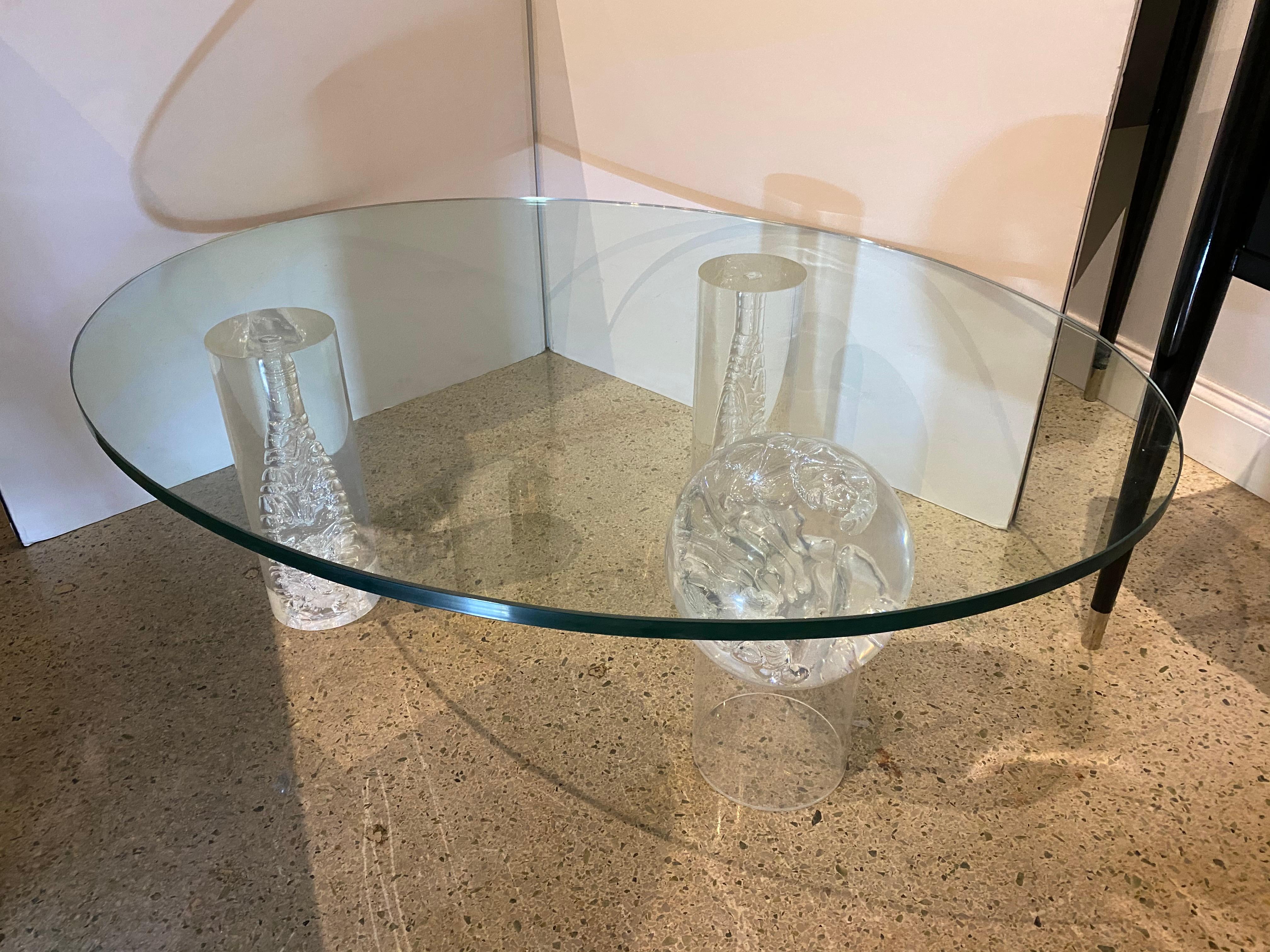 A controlled Bubble Lucite coffee table consisting of 2 cyliners and one sphere, all geometric in form 
adding to the dynamic sculptural feeling to this table. 
Thie piece is adaptable if you would like a smaller or larger pice of glass on it, as