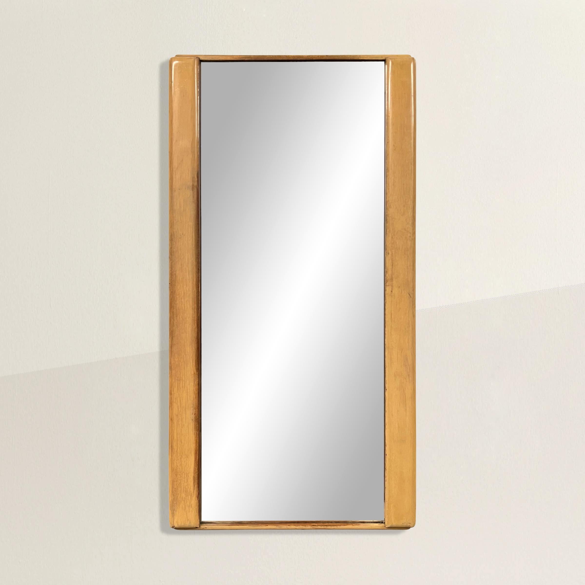 A chic early 20th century American modernist mirror with a beautiful timeless ivory painted birch wood frame that blends seamlessly into any style interior. Perfect in your bedroom, entry way, or bathroom.