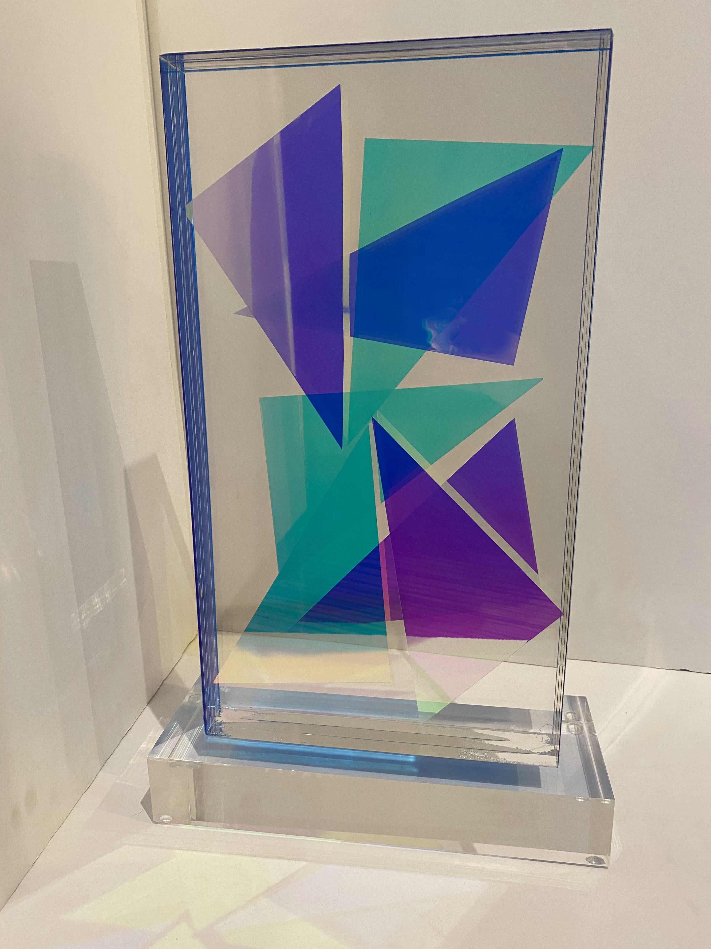 the monolithic lucite block, hand colored on the interiors, with geometric motif, laminated together, on a base. Signed by the artist. Selected Solo Exhibitions

Selected Exhibitions of the artist

NY Art Gallery, Santa Cruz de Tenerife, Spain