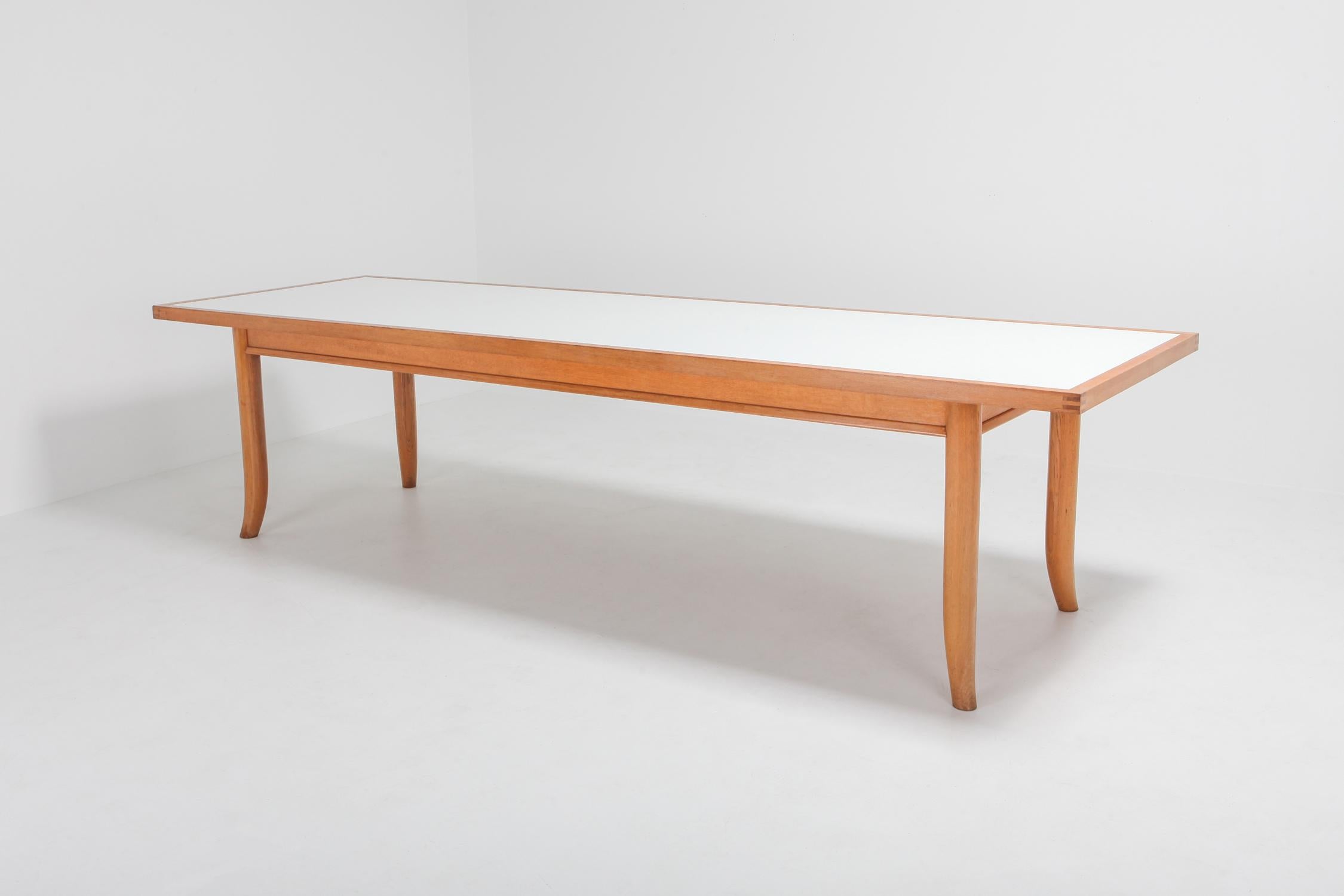 George Nakashima style over size oak dining table has been made in Japan, designed by Robsjohn Gibbings.
Robsjohn Gibbings worked for the same company as Nakashima called Widdicomb. 
This particular piece is more high-end than the Widdicomb