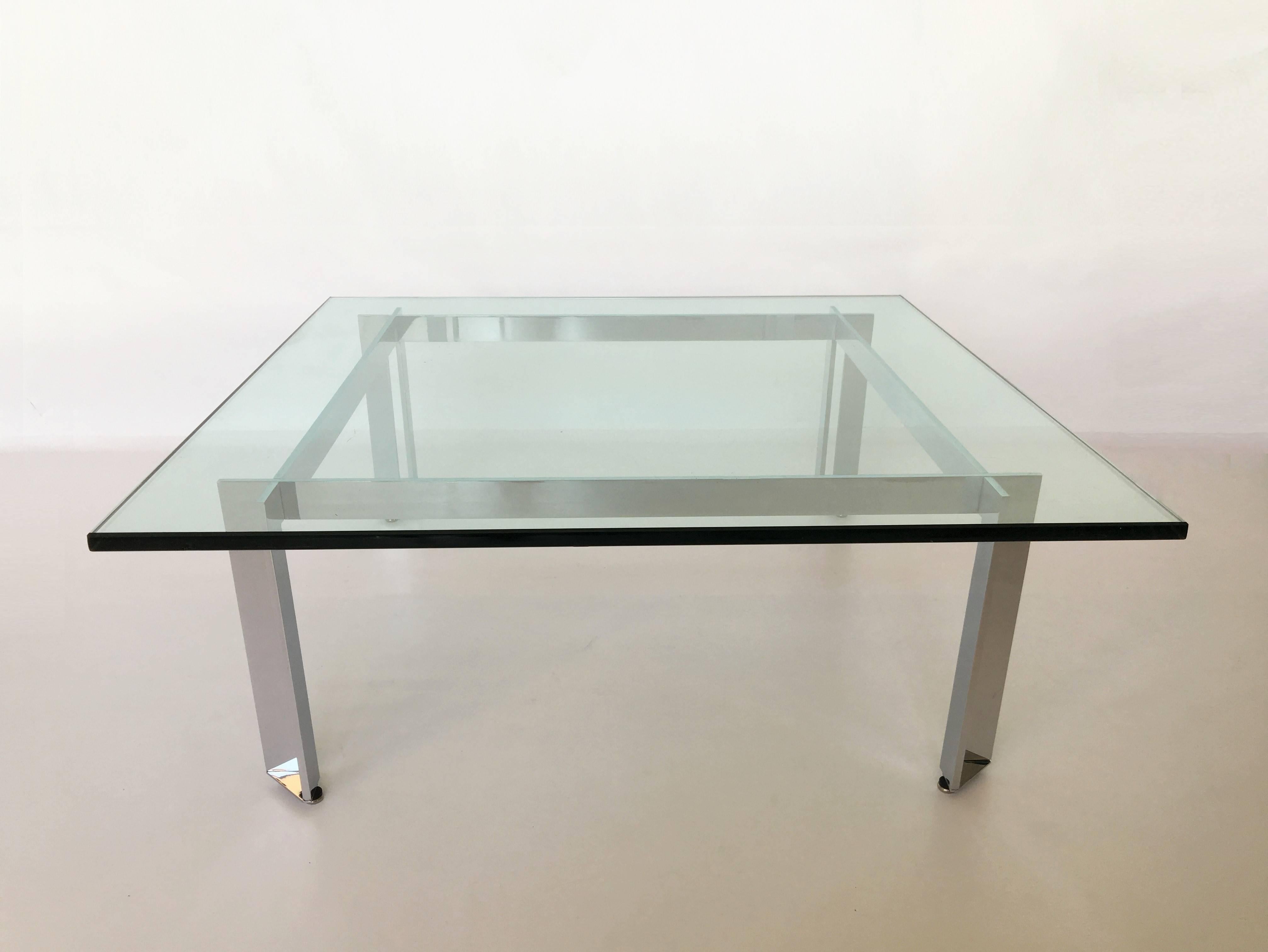 Simplicity and artful detailing defines this coffee table. The independent architectural base of this table offer flexibility and freedom of design expression. A clear glass top displays the 45 degree split leg design, welded into the apron to form