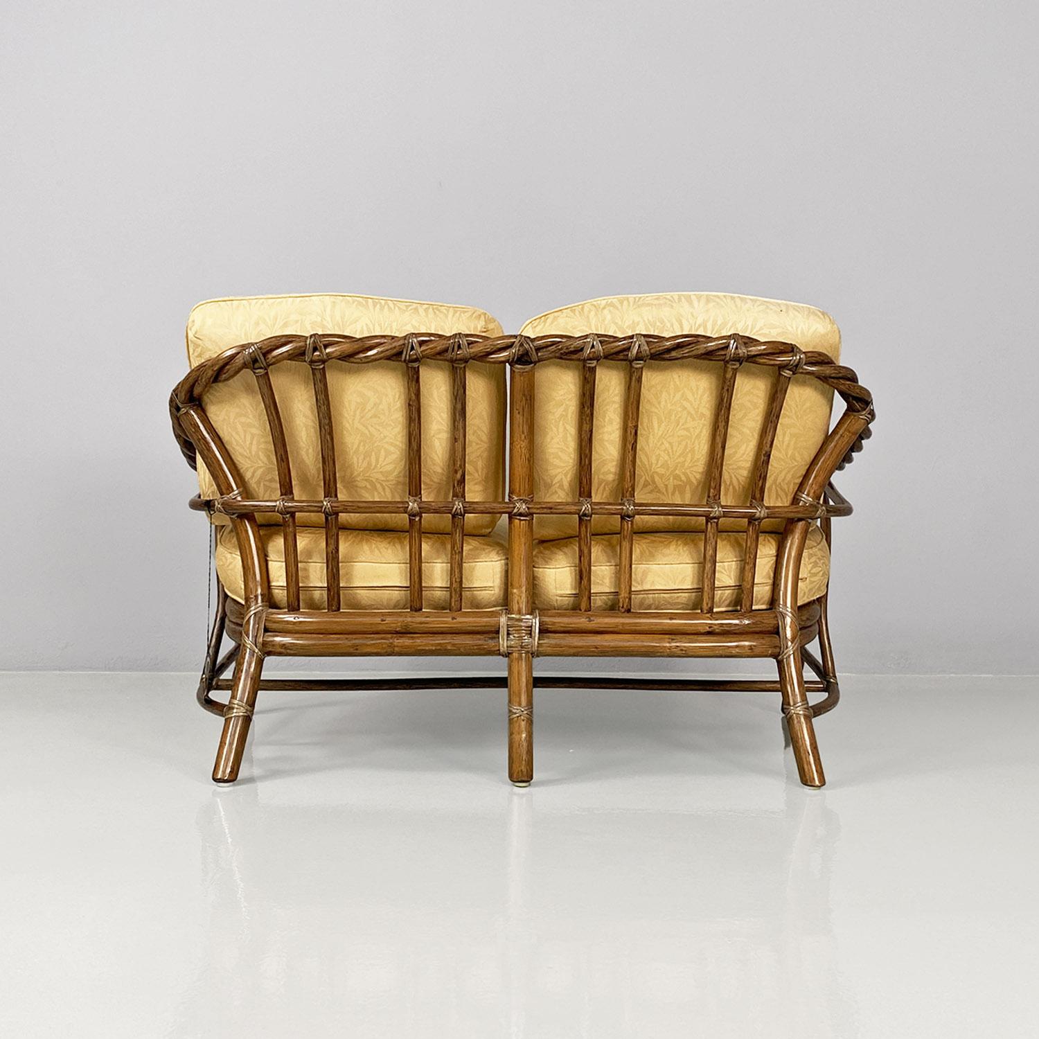 Late 20th Century American modern rattan and beige floreal fabric sofa by McGuire Company, 1970s For Sale