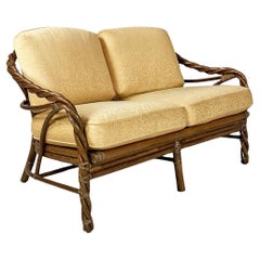 Retro American modern rattan and beige floreal fabric sofa by McGuire Company, 1970s