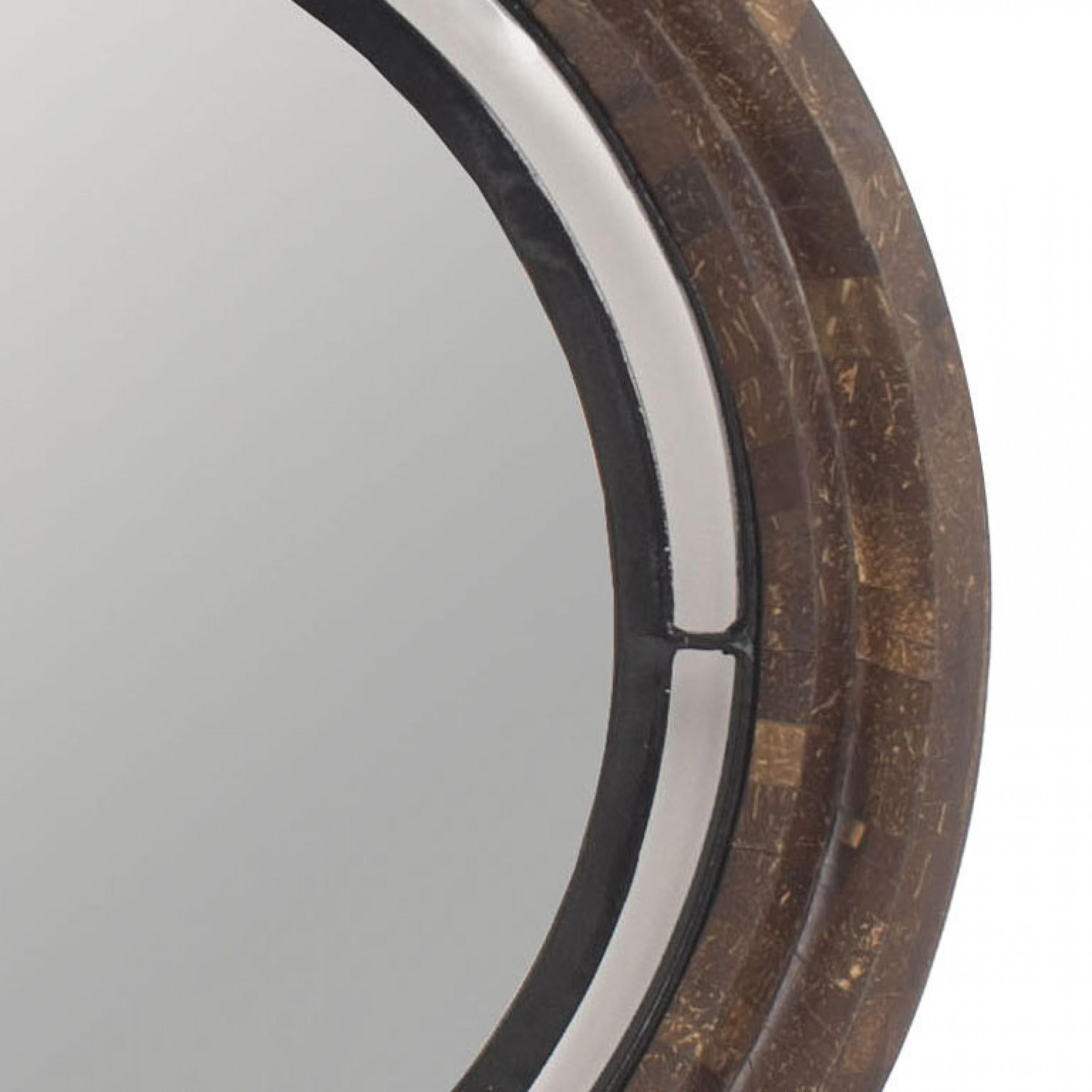 American Modern circular wall mirror with a beveled edge in an iron frame, float mounted in a concentric ,beveled, dark wooden frame.