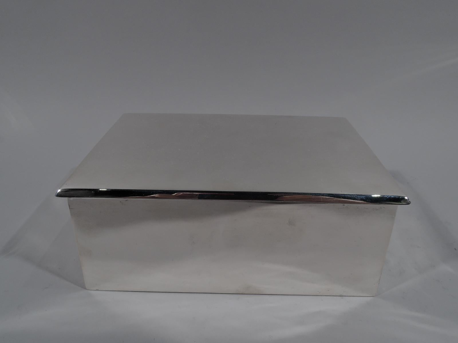 American Modern sterling silver box. Made by William B. Kerr in Newark, ca 1910. Straight and gently inward tapering sides. Cover hinged and rectangular with slight overhang. Box and cover interior cedar lined. Underside felt lined. Fully marked and