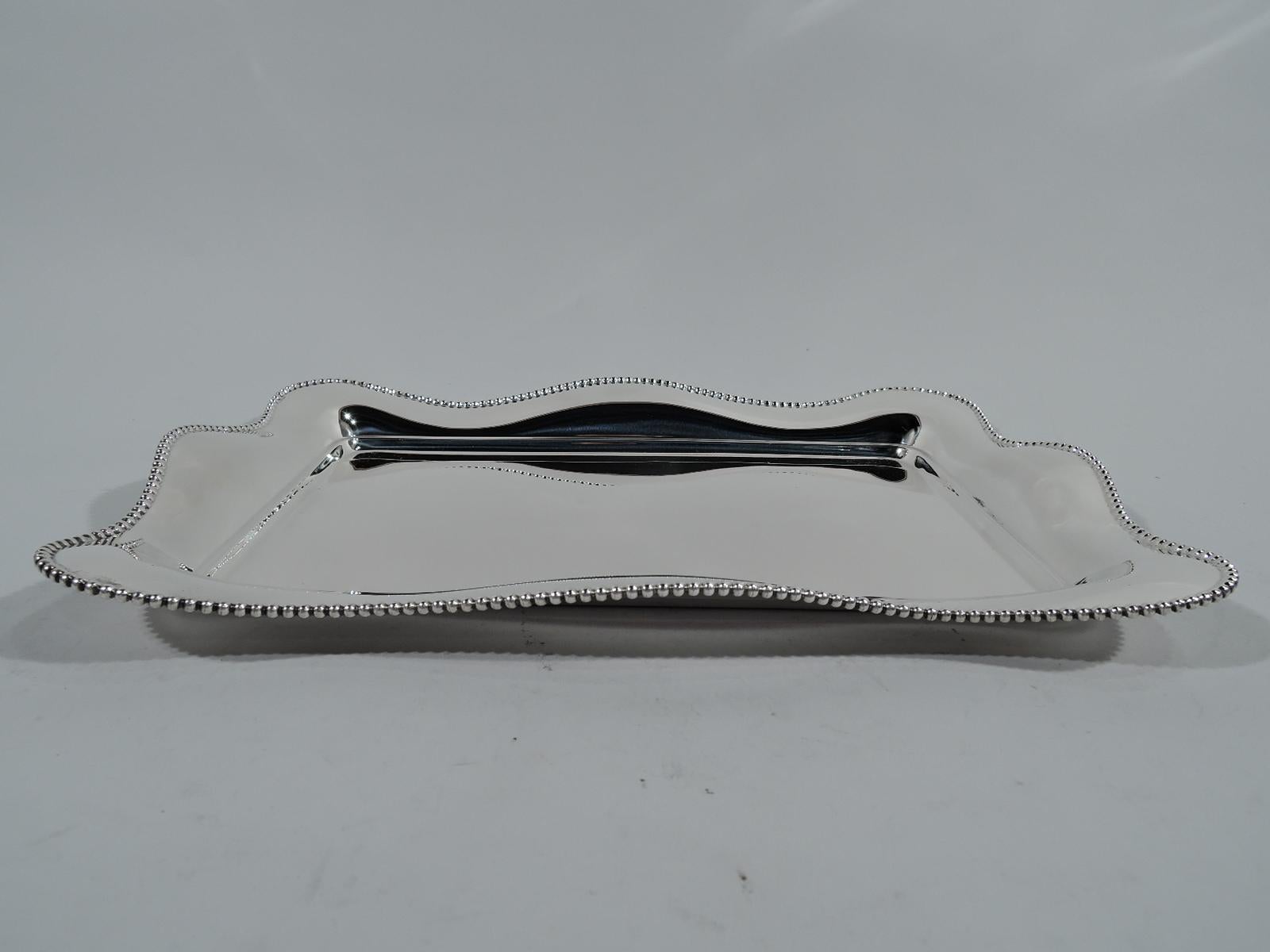 Modern sterling silver tray. Made by R. Wallace & Sons in Wallingford, Conn, circa 1910. Rectangular well with wavy and beaded rim. Hallmark includes no. 538. Weight: 12.5 troy ounces.