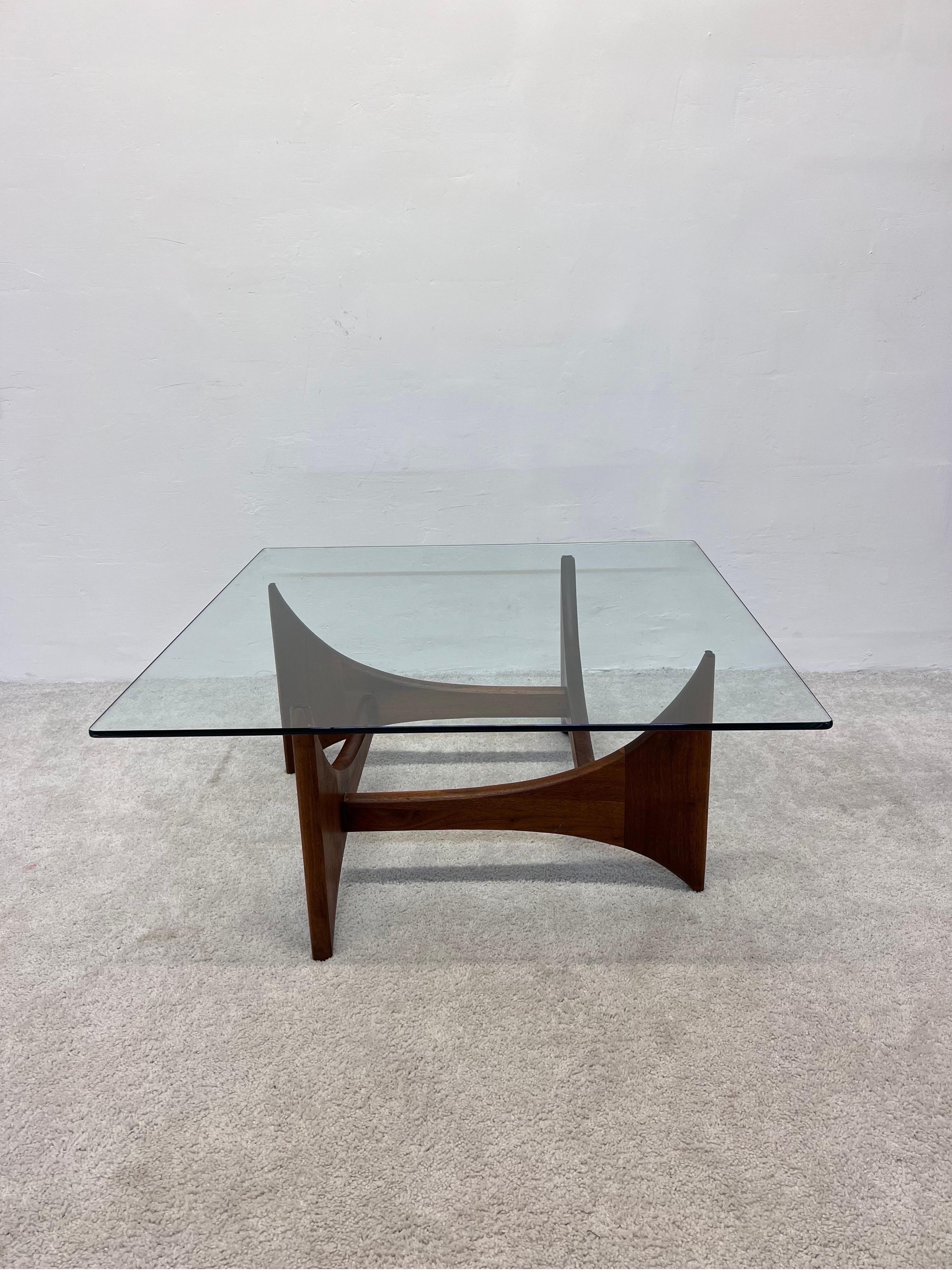 Sculptural walnut carved wood base with pencil edge glass top coffee or cocktail table by Adrian Pearsall, 1970s.