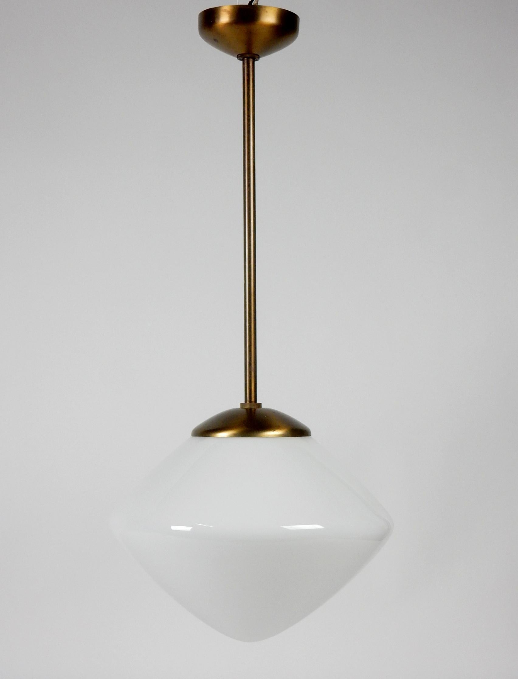 Modernist pendant lamp by The Miller Company of Connecticut.
6 WERE available however only 2 smaller with long drop are available.
In the style of Paavo Tynell design with smooth clean lines.
Original thin hand spun milk glass shade.
Brass tone