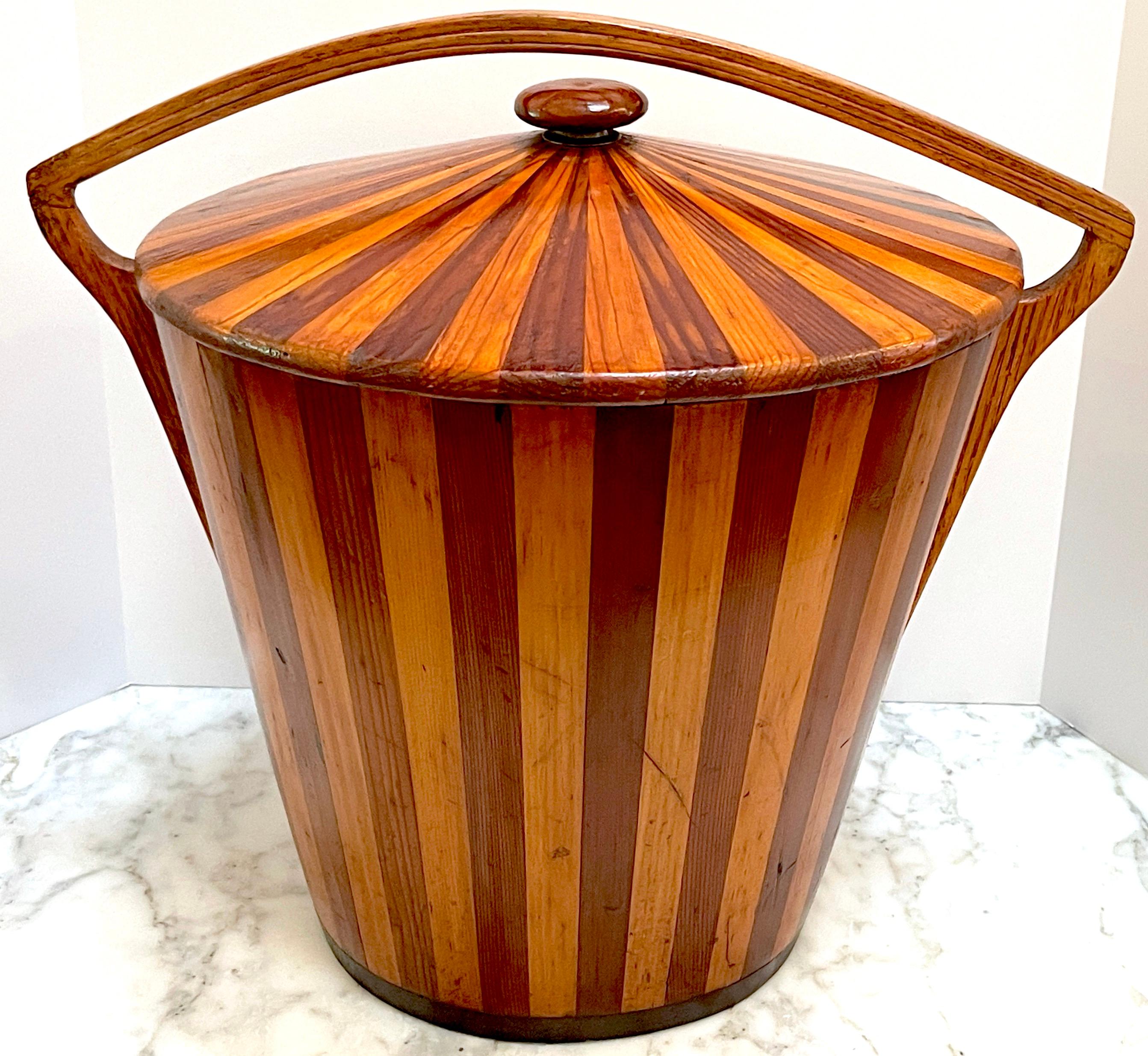 American Modernist Geometric  Inlaid Two-Tone Wood Lidded Bucket /Vessel, 1950s 

Presenting a tour de force of unknown American modern design, this inlaid two-tone wood lidded bucket/vessel from the 1950s is a remarkable piece that showcases the