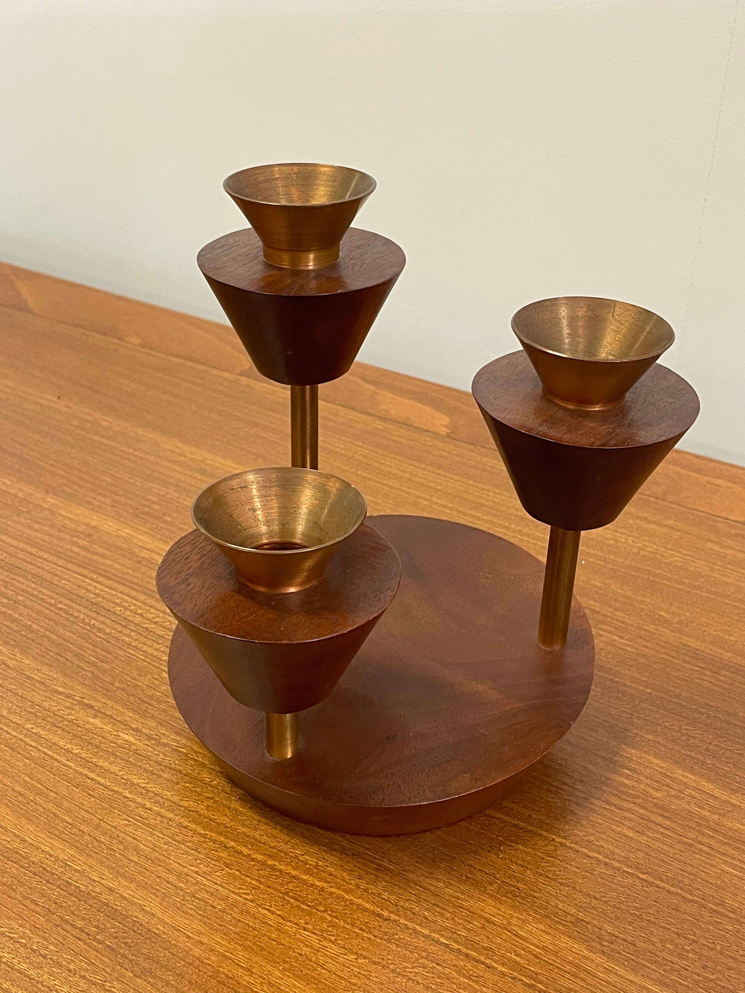 Unusual artisan made tiered candelabra in walnut. Very good condition, with light wear. Signed to underneath in what appears to read 