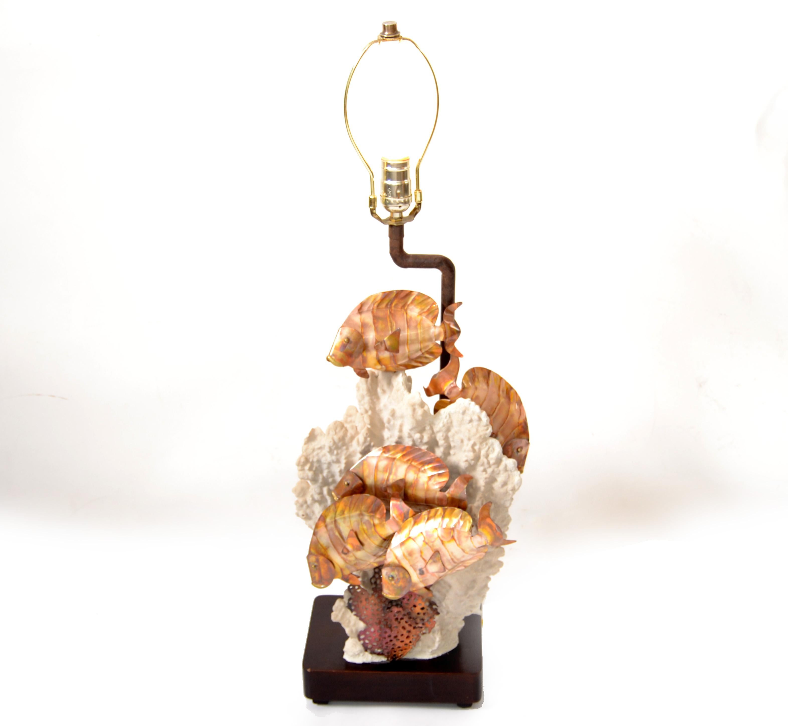 Brutalist Style whimsical nautical Brass Fish on a natural white coral core and mounted on a rectangle Wood Base. 
The Stem is a copper piece of pipe and topped with the socket and harp.
Very detailed and real looking.
Base Measures: 8.5 x 6.5 x