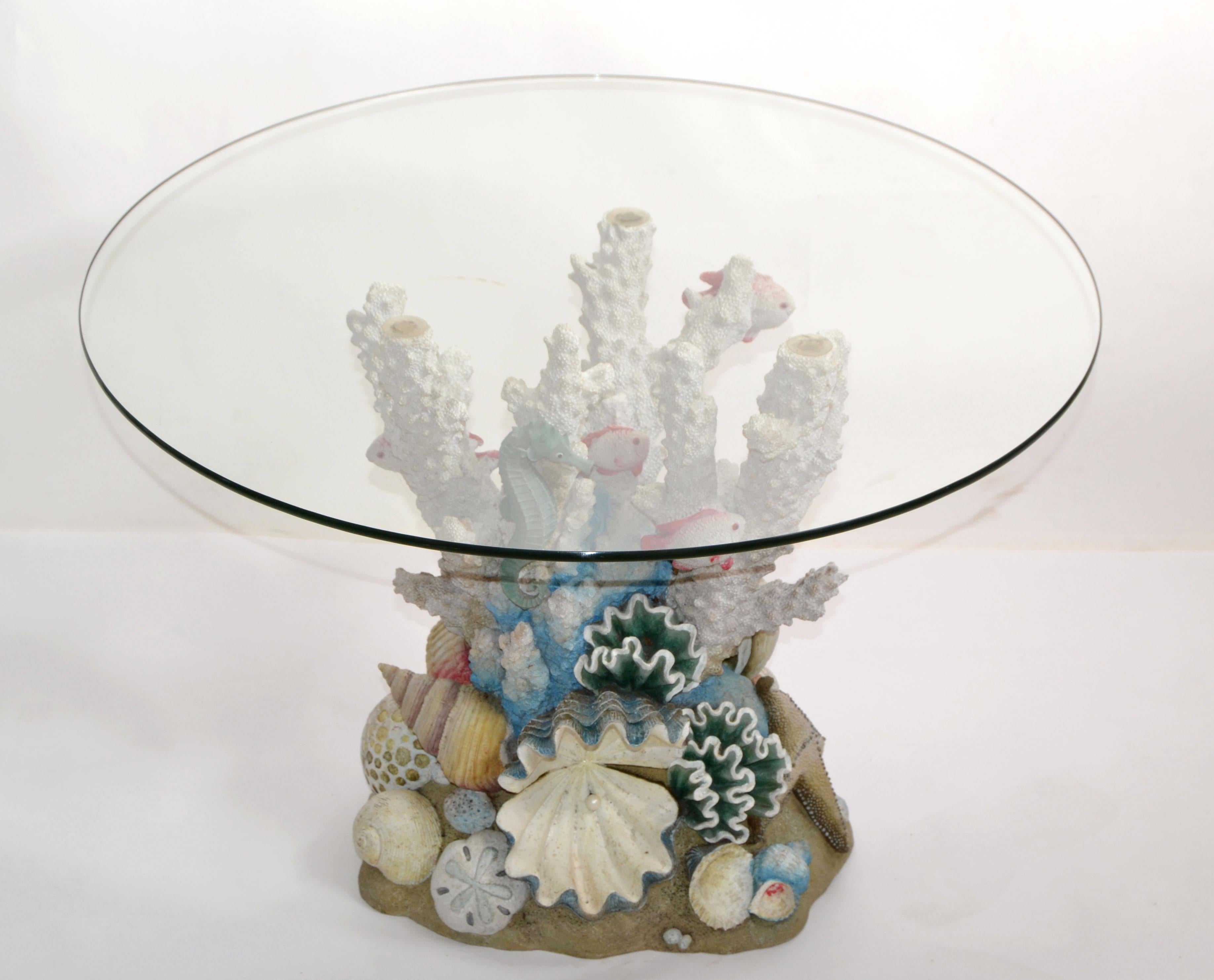 Whimsical nautical coffee or center table in plaster & resin and comes with a 28 inches diameter glass top.
The base depicting an ocean coral with many different aquarium fish, it measures 16 x 12 x 20 inches height.
Very detailed and real looking.