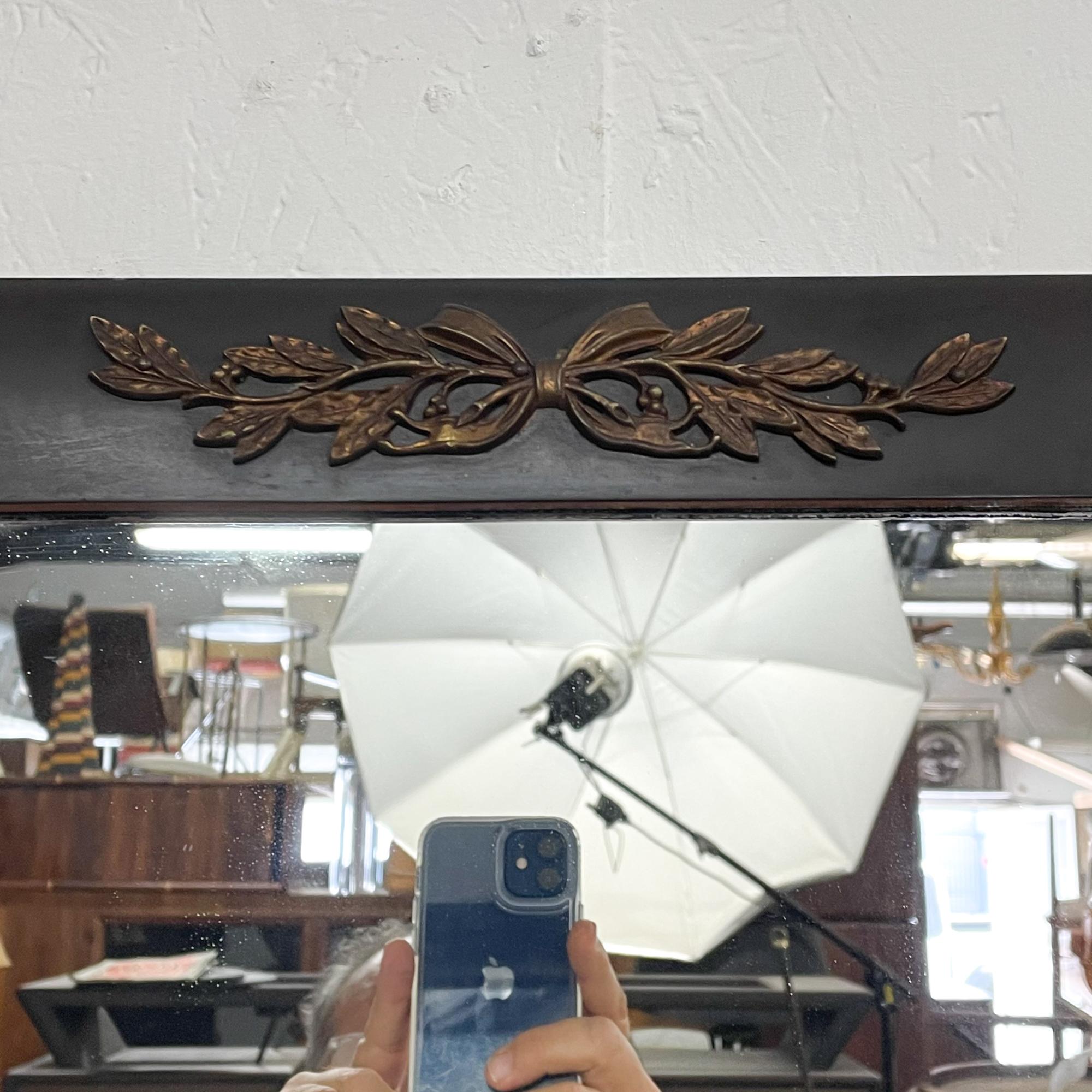 1940s Neoclassical wall mirror designed and manufactured by Landstrom furniture of Rockford, Illinois. 
Wood frame with sculptural lines and classical brass ornamentation. 
Made in the USA
Complete bed set is available ask dealer.
Wood and mirror