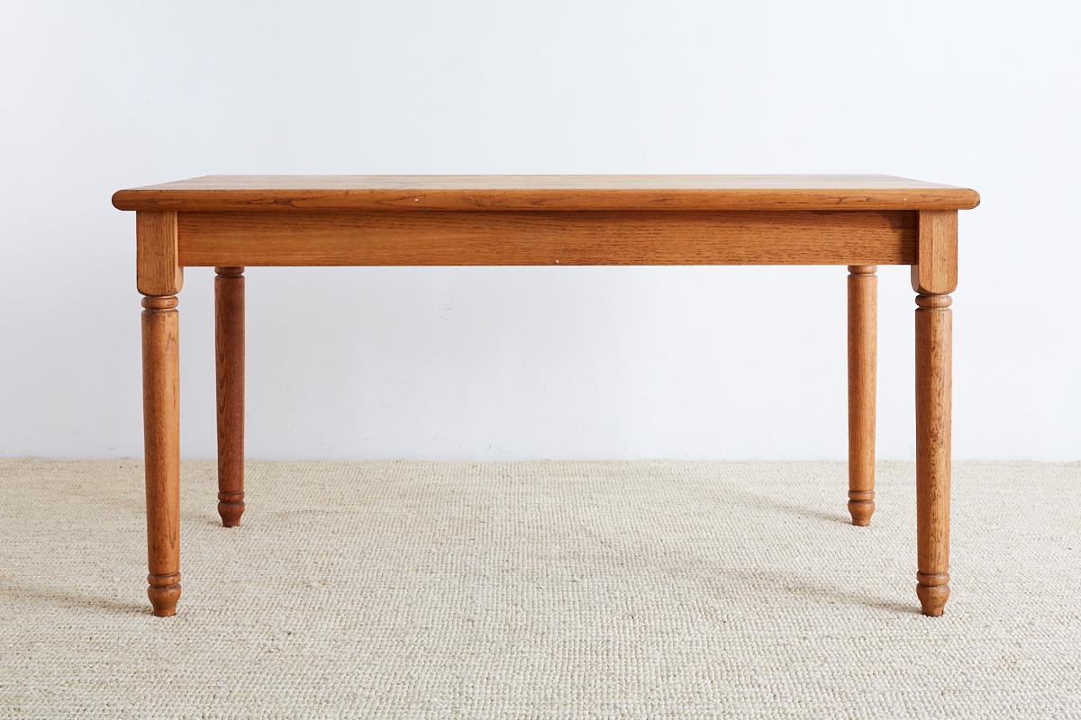 Rustic butcher block style farmhouse table featuring a solid American oak top. The top was constructed from 35 planks of 1.5